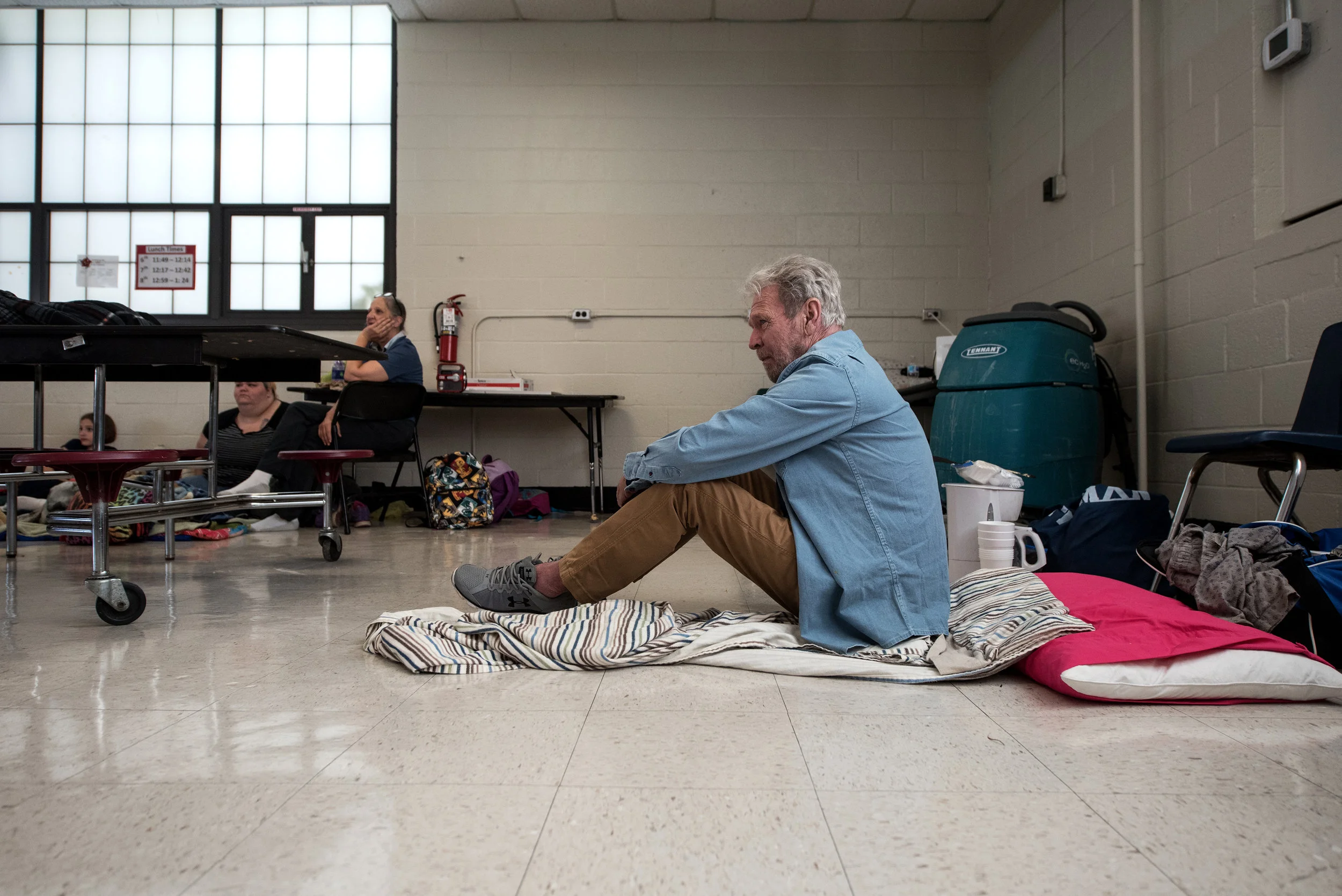 Patrick Russell sits in Burgaw Middle School as he seeks shelter ahead of the forecasted landfall of Hurricane Florence in Burgaw, North Carolina, USA, 12 September 2018.