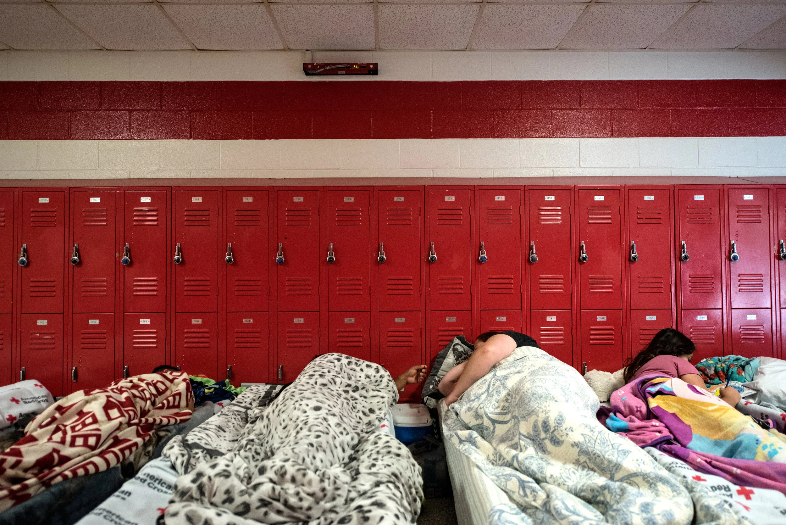  People evacuate ahead of the forecasted landfall of Hurricane Florence and seek shelter at Burgaw Middle School in Burgaw, North Carolina, USA, 12 September 2018. 