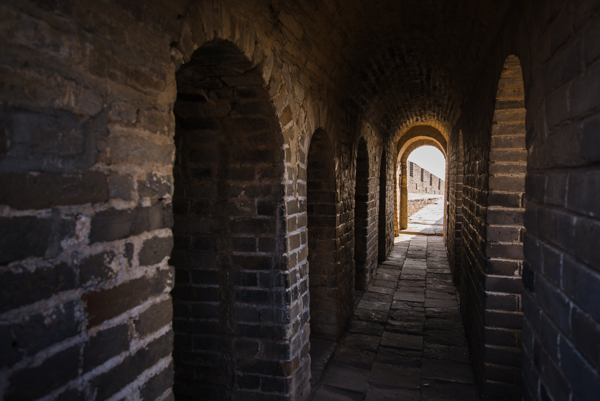 long-stone-corridor-with-stairway-in-ancient-PAH2KVR.jpg