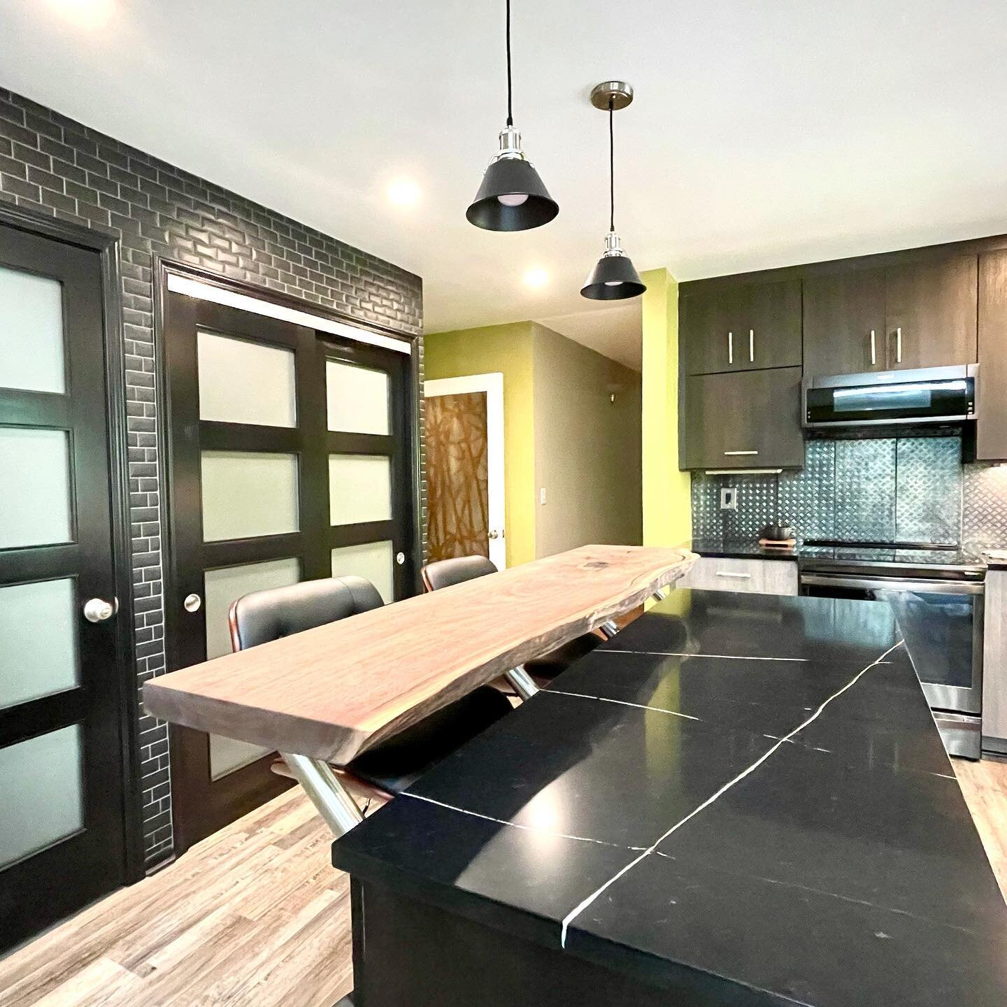 We wrapped up this kitchen a few weeks ago and have to hand it to these fun clients for going bold and with their material and color selections.  Our favorites are the black pantry doors with small black tile surround, black quartz countertop and gor