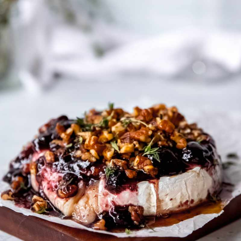 Baked+brie+wheel+with+plum+jelly.png