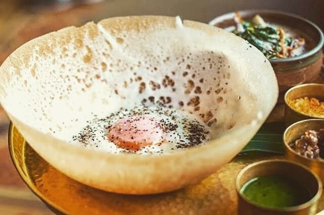 Hungry mate? How about some brekky hoppers? 
Hoppers in their simplest form are bowl-shaped pancakes made from fermented rice flour and coconut milk. Cooked in small round pans, they tend to come out crispy round the edges, thicker at the bottom. The