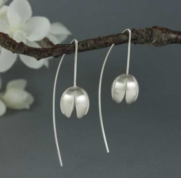 Gabriella Casemore Gabriella Casemore’s jewellery is inspired by her fascination with the repetitive patterns found in flowers as well as vintage textiles. She designs by exploring her ideas with paper first; folding, cutting, layering, then eventually translating these ideas into highly wearable silver jewellery.