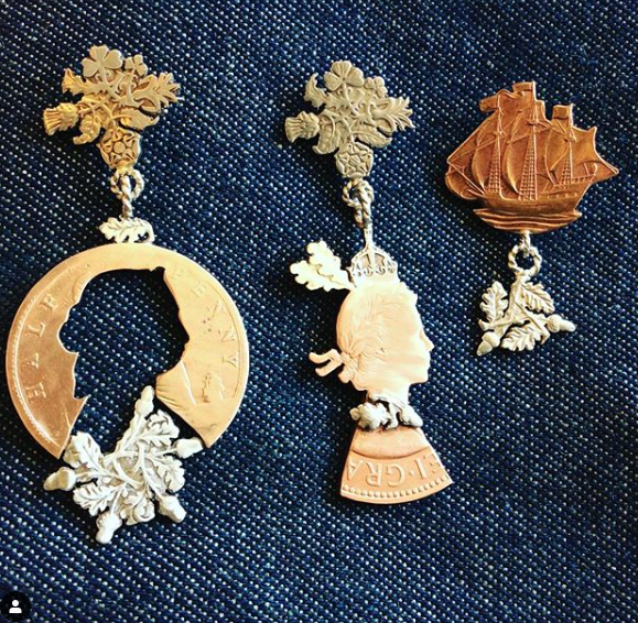 Rachel Eardley Rachel is influenced by the simple day-to-day objects in our lives and the traditions of the British Isles. Each piece is handcut from decommissioned coins from around the world and comes in its own unique box, individually illustrated by Rachel with the coin’s design, date and origin.