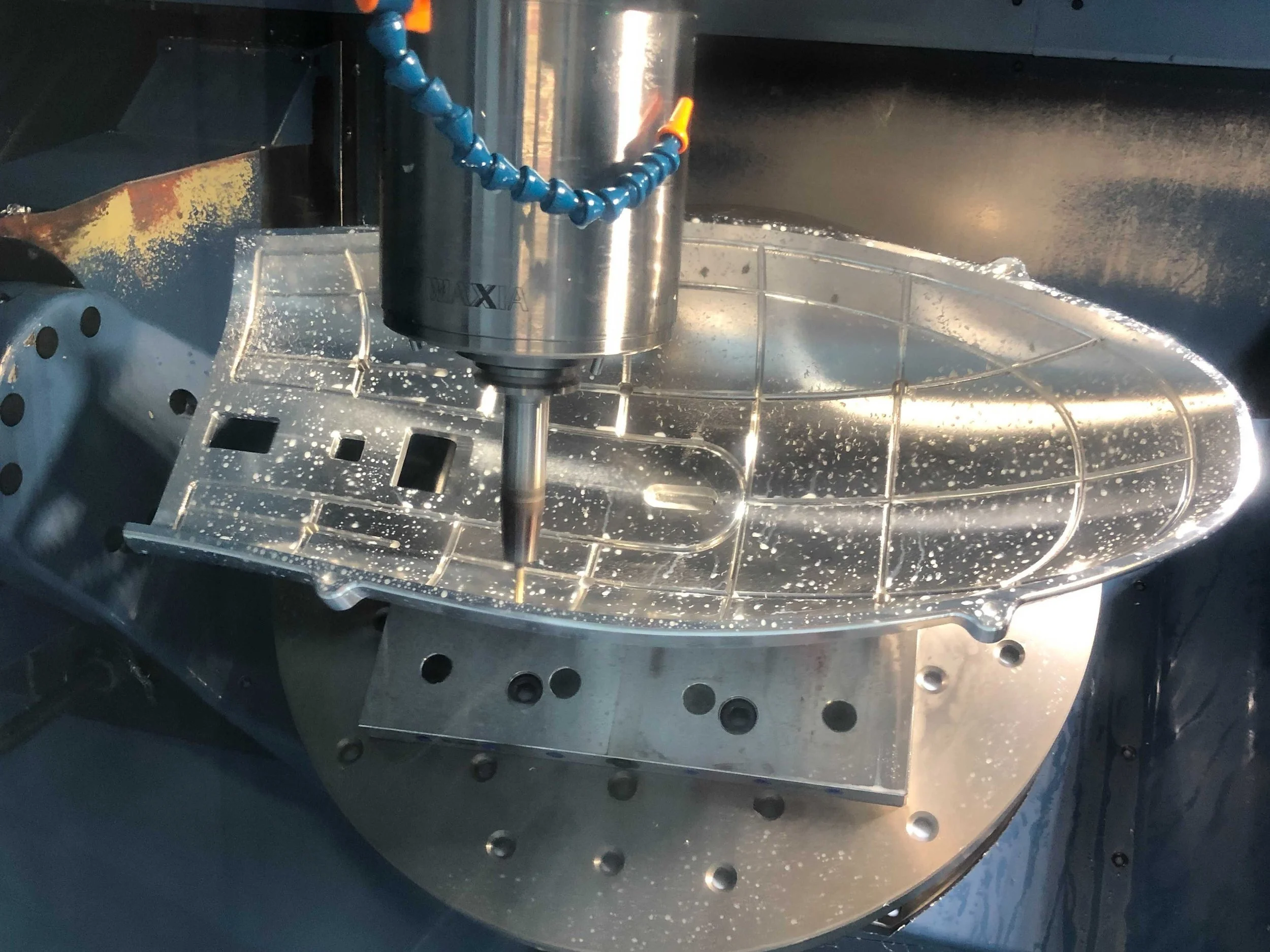 5-axis machining of vacuum grooves in a composite trim fixture