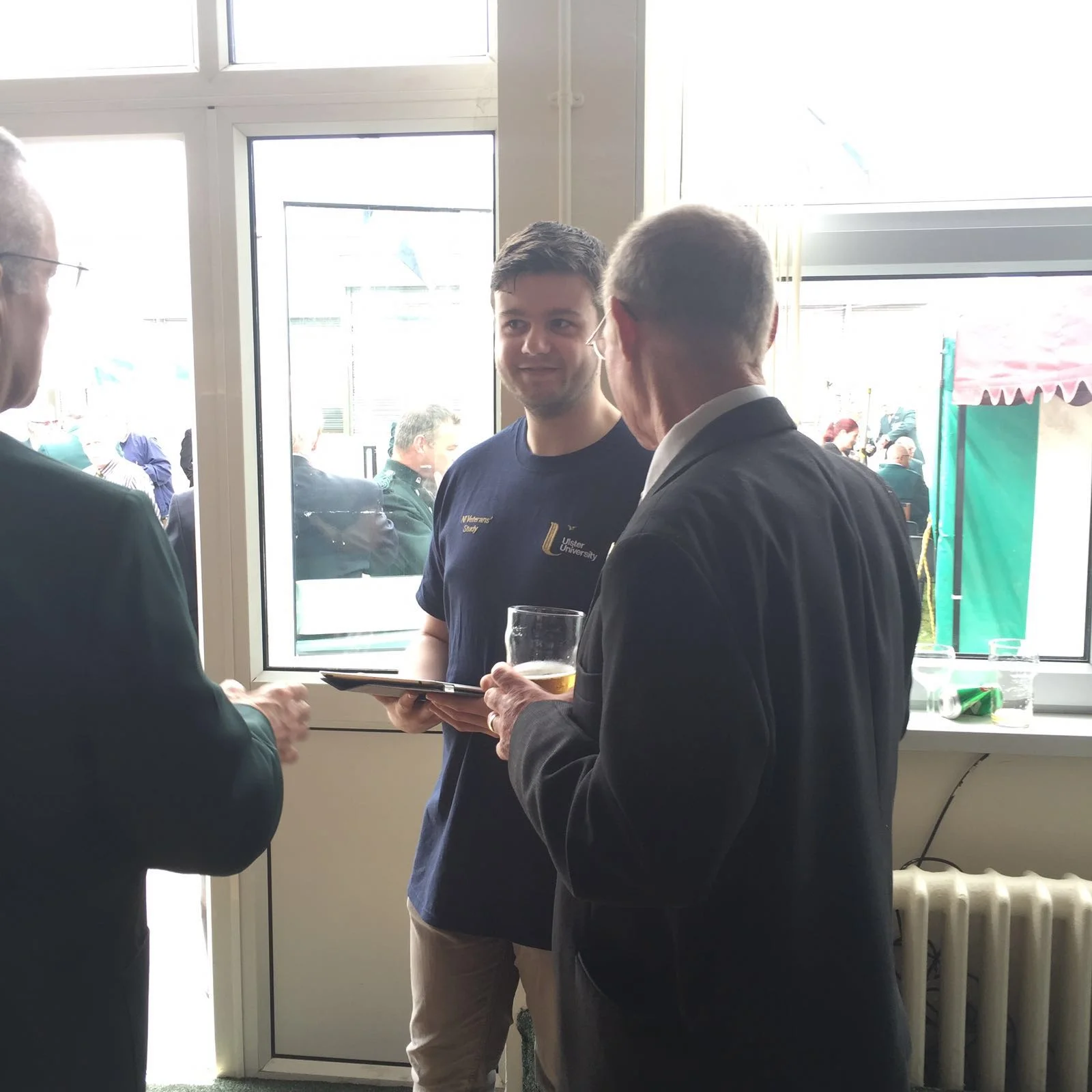 Mr Martin Robinson (PhD Student) photographed discussing the project with veterans at Old Soldier's Day, Belfast.