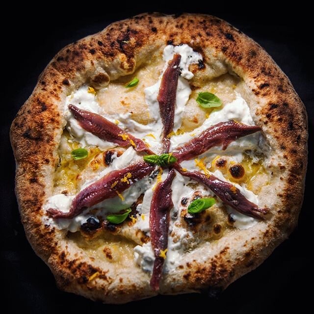 Introducing the first pizza of the &quot;Specials&quot; series.⁠⠀
⁠⠀
Our signature dough here shines like a diamond.⁠⠀
Topped with⁠⠀
- Burrata⁠⠀
- Anchovies from the Cantabrian Sea (amazing product)⁠⠀
- Lemon zest⁠⠀
⁠⠀
Simple flavours but work so wel