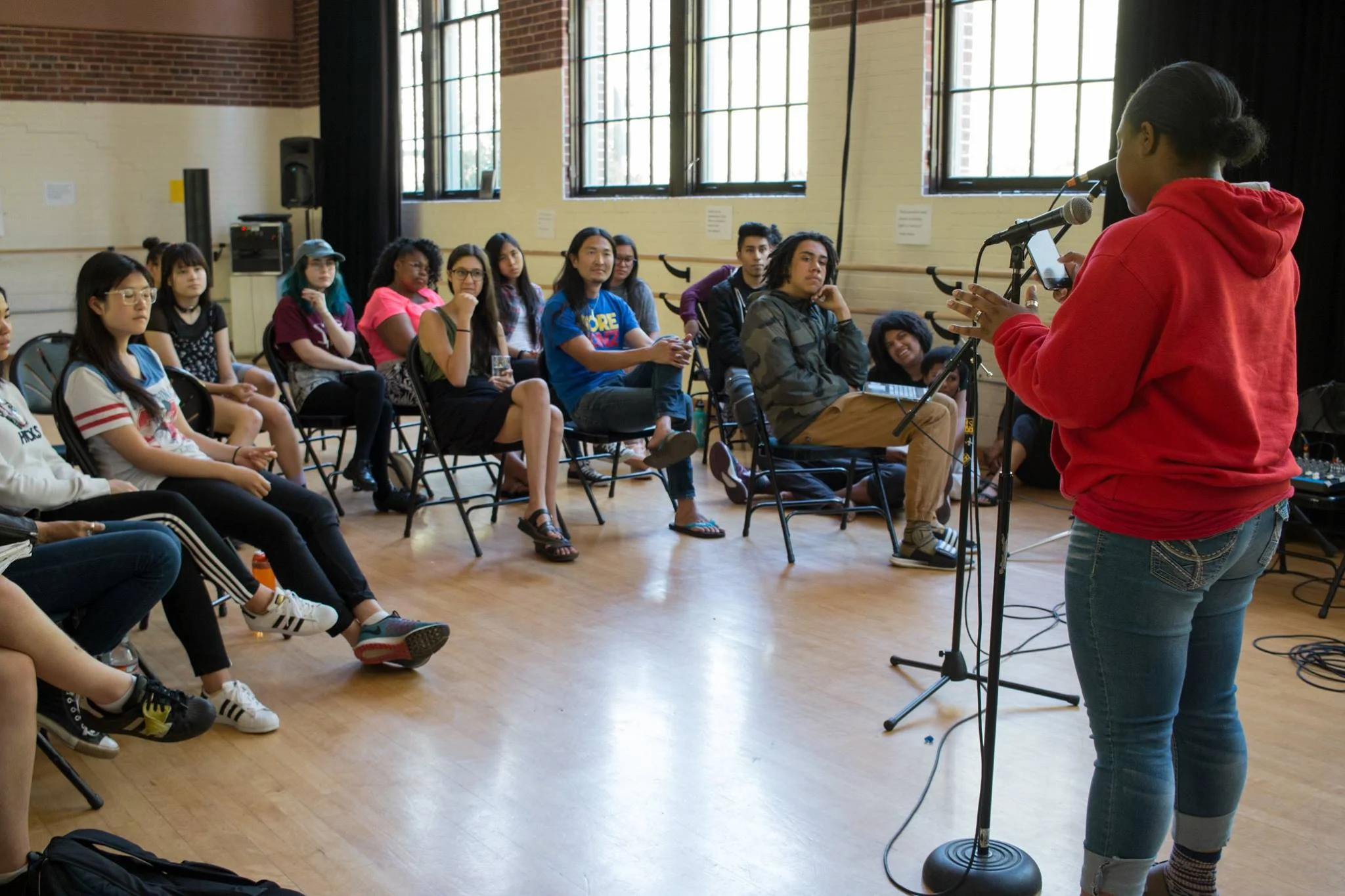 LIO wows the crowd with her poetry. Photo credit: Amy Piñon. 