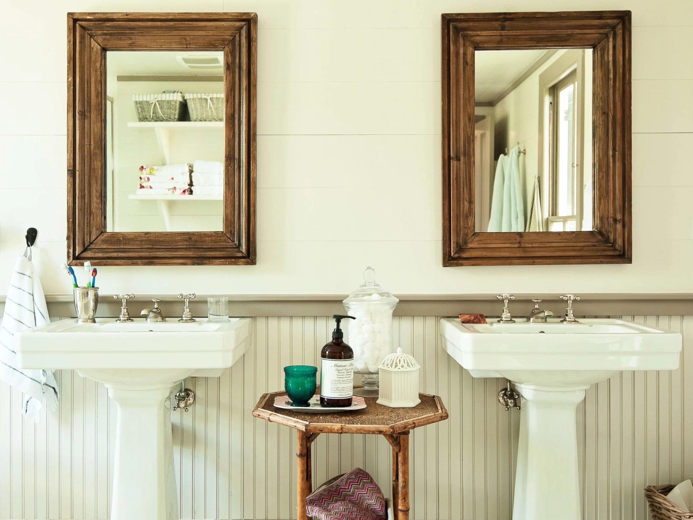 Although the roomy master bath was an addition to the house, Putman wanted it to look like it had been built with the original structure so she sourced old-school fixtures and materials.