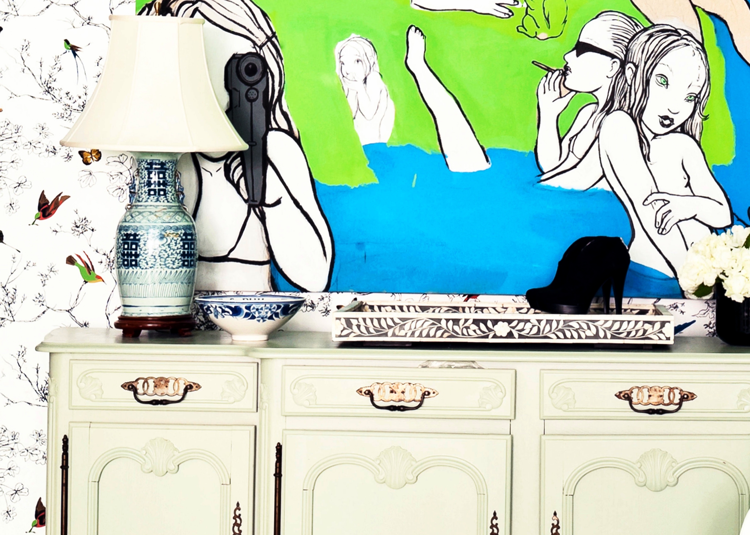 Juxtaposition of a traditional sideboard against modern art is one of the loft subtle decorating strength. The painting, entitled “Now I'm Gonna Take a Vacation" by Rita Ackerman, was scooped up after Chassie visited a show of her work at Andrea Rosen Gallery. “I started getting into her when she illustrated the cover of a Sonic Youth album. I really wanted this huge painting she had done on denim but it sold so I bought this one and I do love it,” says Post. The sideboard is a hand-me-down from her sister (though Chassie gave it her own spin with a swath of greyish-green paint). It turns out the loft’s unique style is just a reflection of Post’s own likings and history. “I am crazy for art, music and fashion,” she declares. These days Post is regular face on TV shows ranging from The Today Show to Access Hollywood.