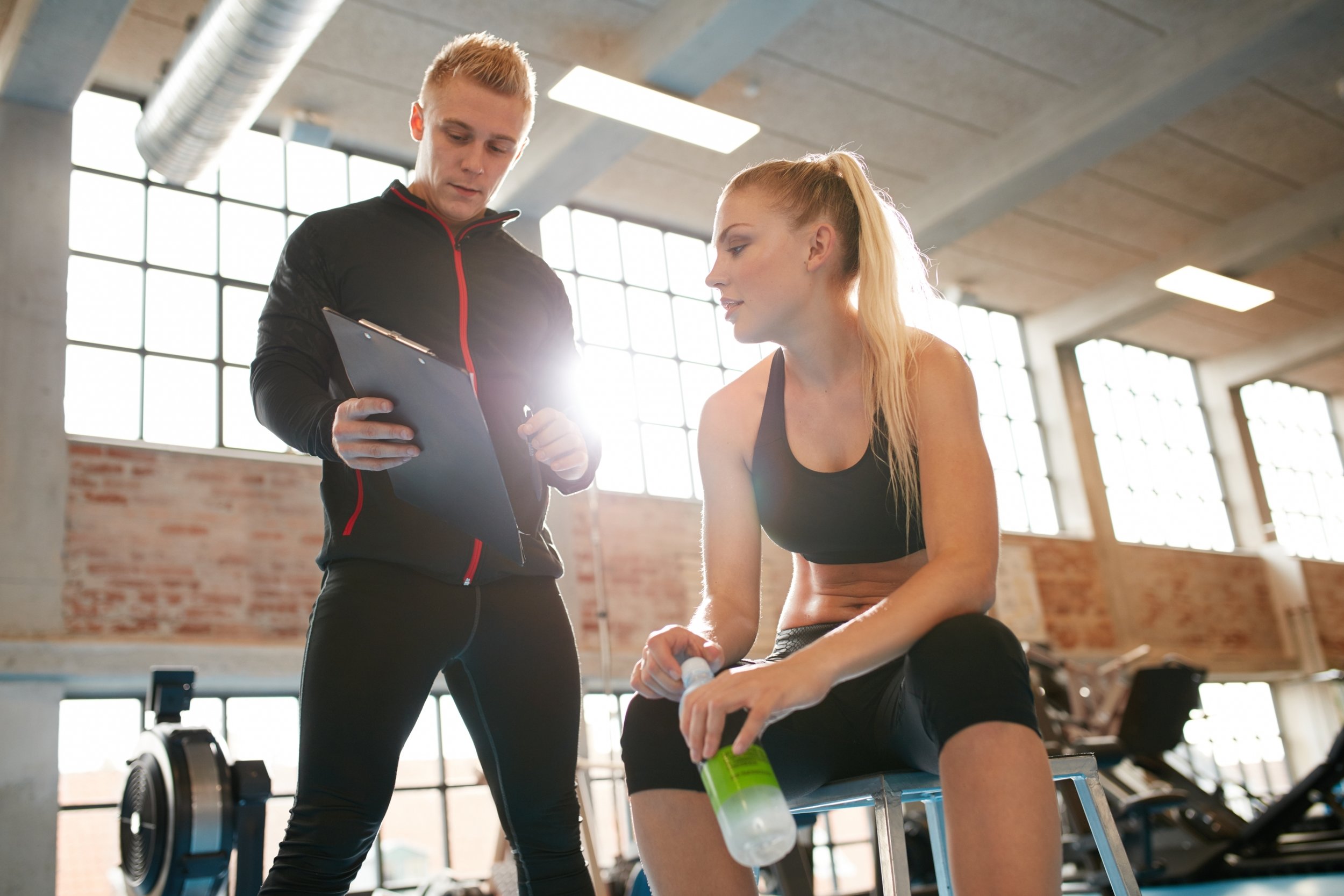 bigstock-Personal-Trainer-Making-An-Exe-116813384 (1).jpg
