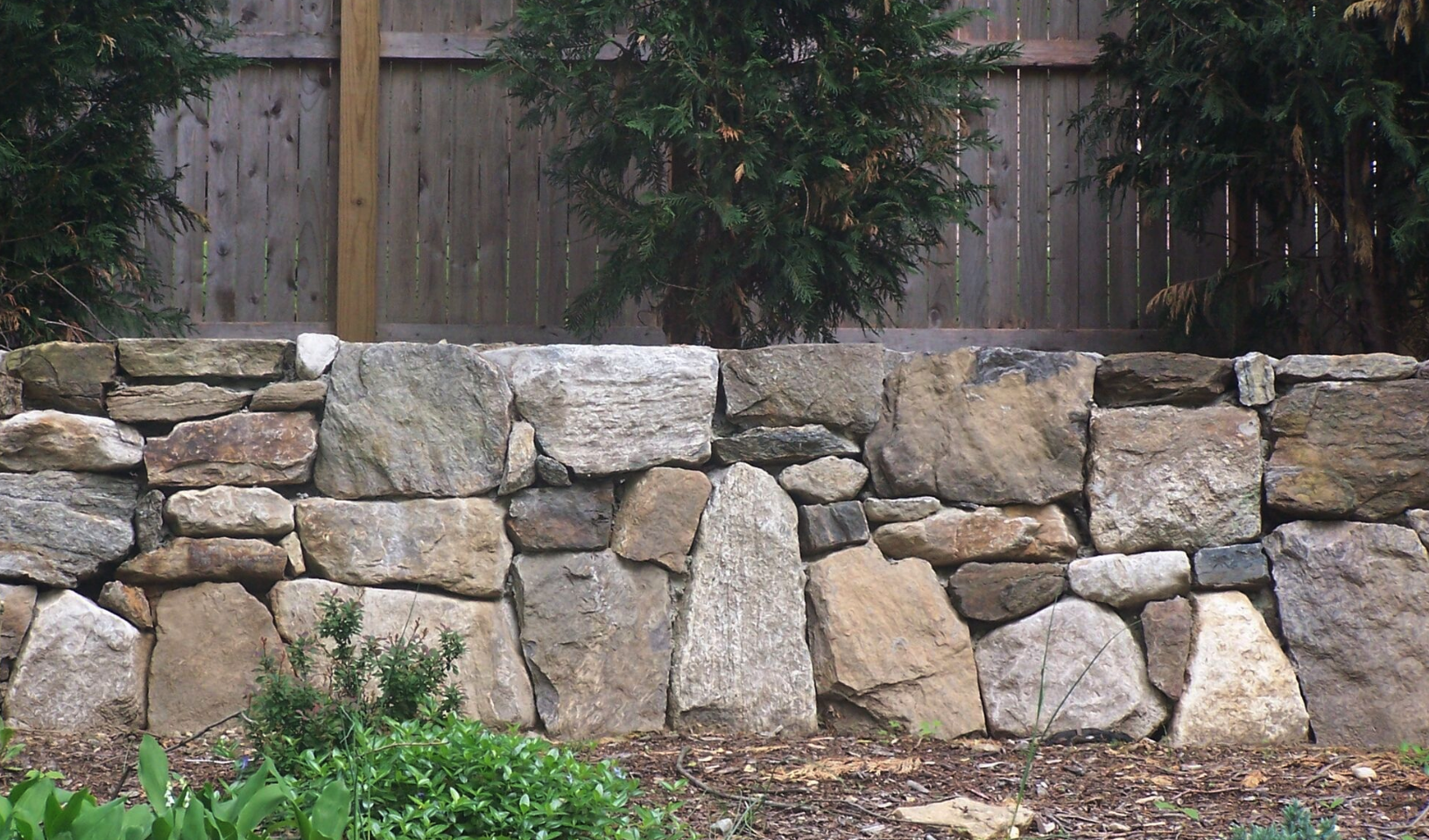 Westchester County, NY natural stone retaining wall and steps and patio