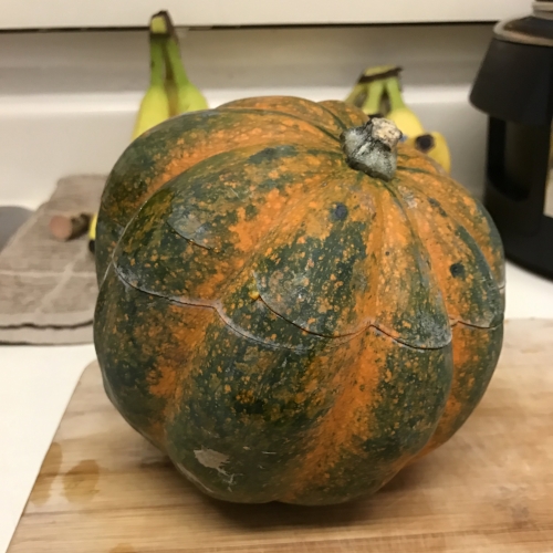 I worked hard at cutting the top off of this acorn squash and still managed to cut it unevenly!