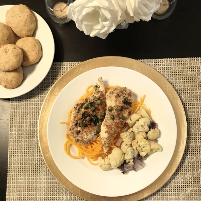 Whole 30 chicken piccata with butternut squash noodles and roasted truffle cauliflower with Whole 30 dinner rolls. 