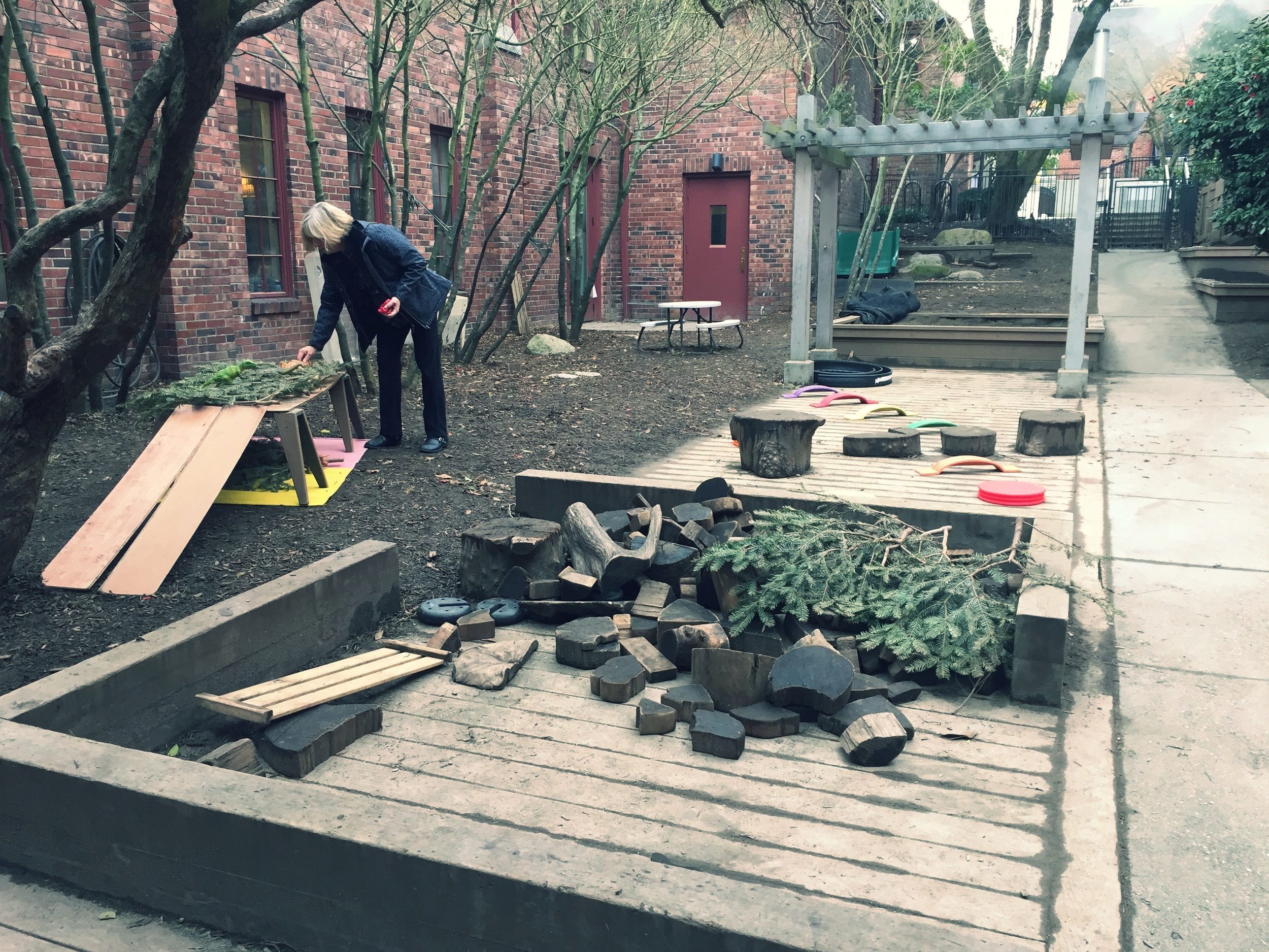 Teacher Deb setting up the playground.