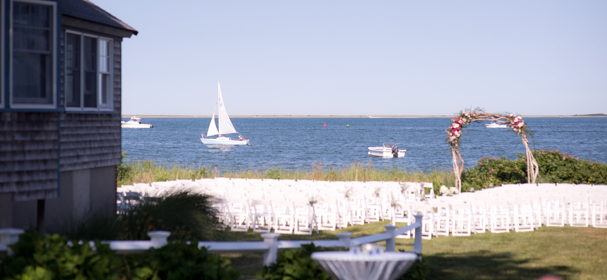 The ceremony took place under an arch of driftwood collected from the beach at the foot of the bride’s family home.