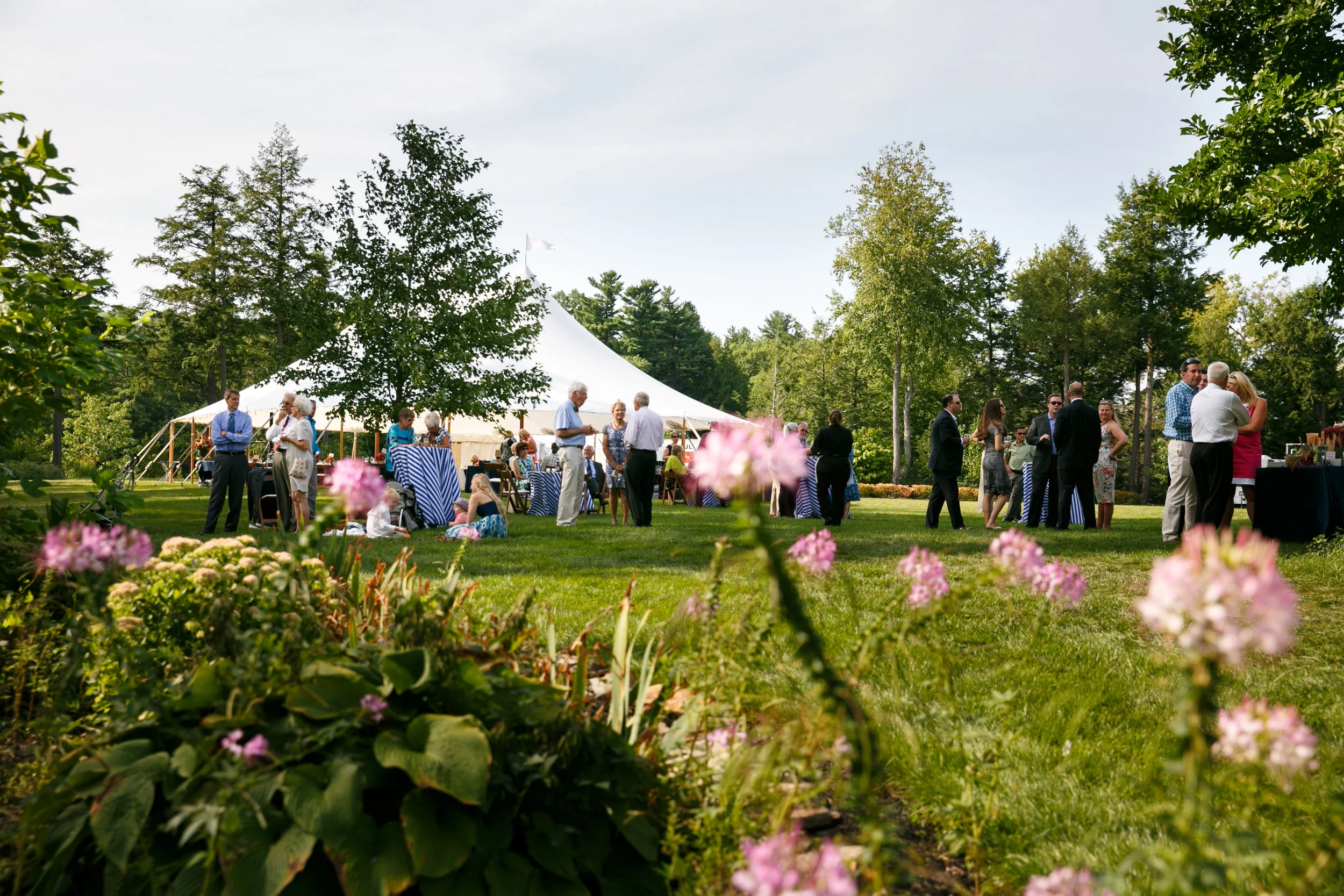 Guests enjoyed cocktail hour by the tent while nieces and nephews frolicked on the expansive lawn.