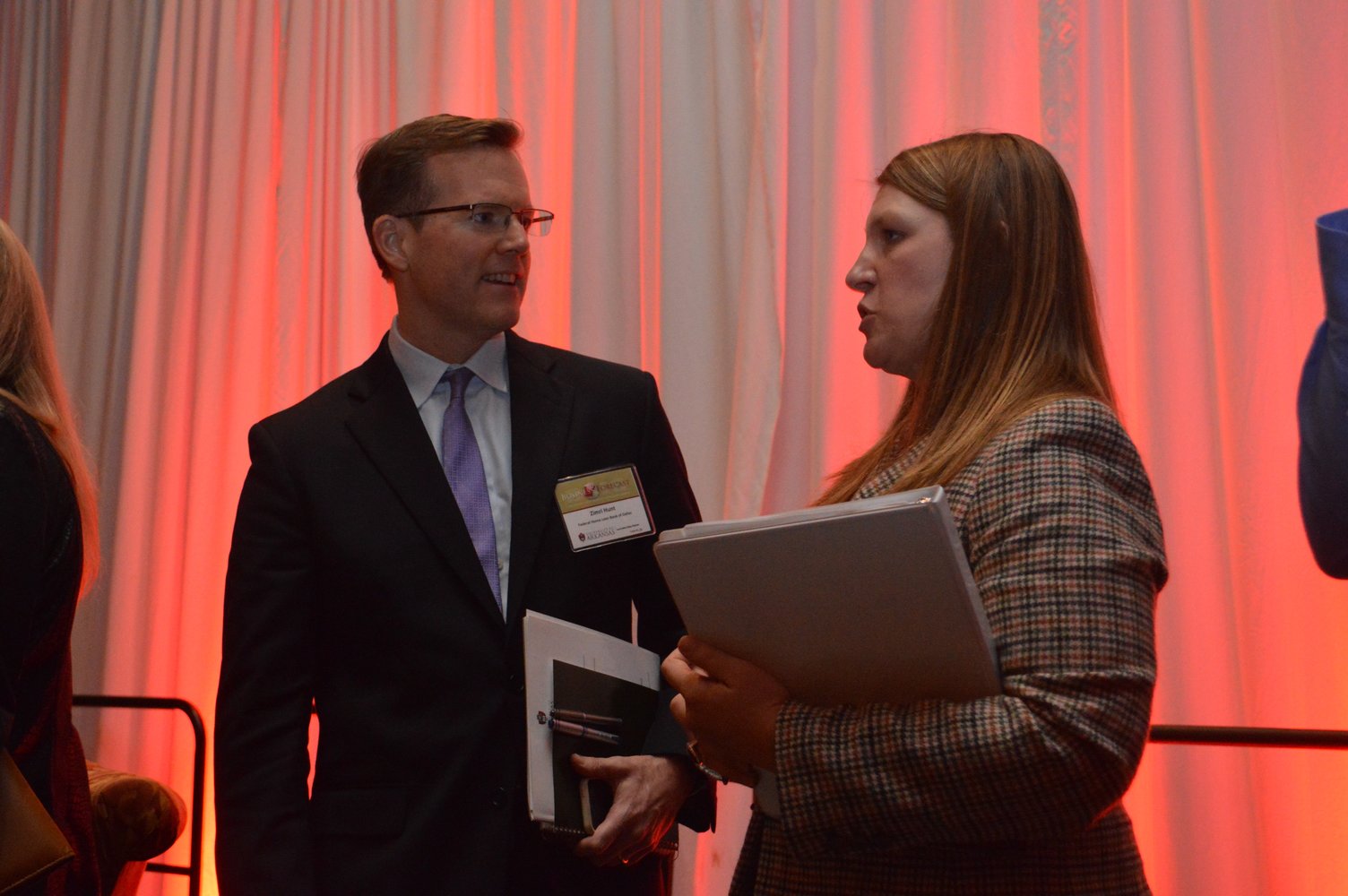 University of Arkansas economist Kathy Deck talks with Zimri Hunt of the Federal Home Loan Bank of Dallas after today’s business forecast luncheon in Rogers.