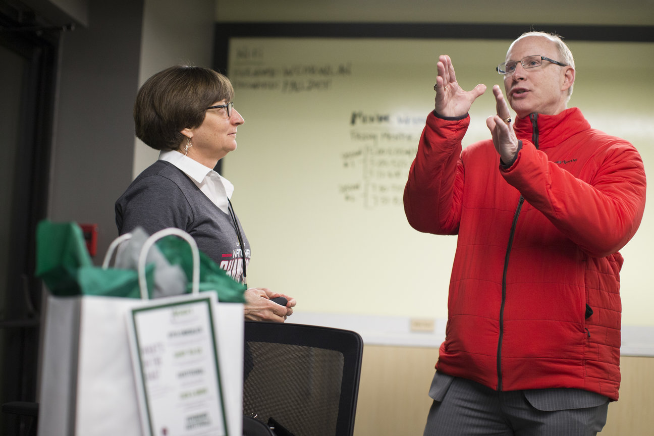 Ross DeVol, a Walton Family Foundation fellow, talk with Carol Reeves during Mentor Weekend at the Brewer Family Entrepreneurship Hub in Fayetteville. Reeves is associate vice provost for entrepreneurship at the University of Arkansas.