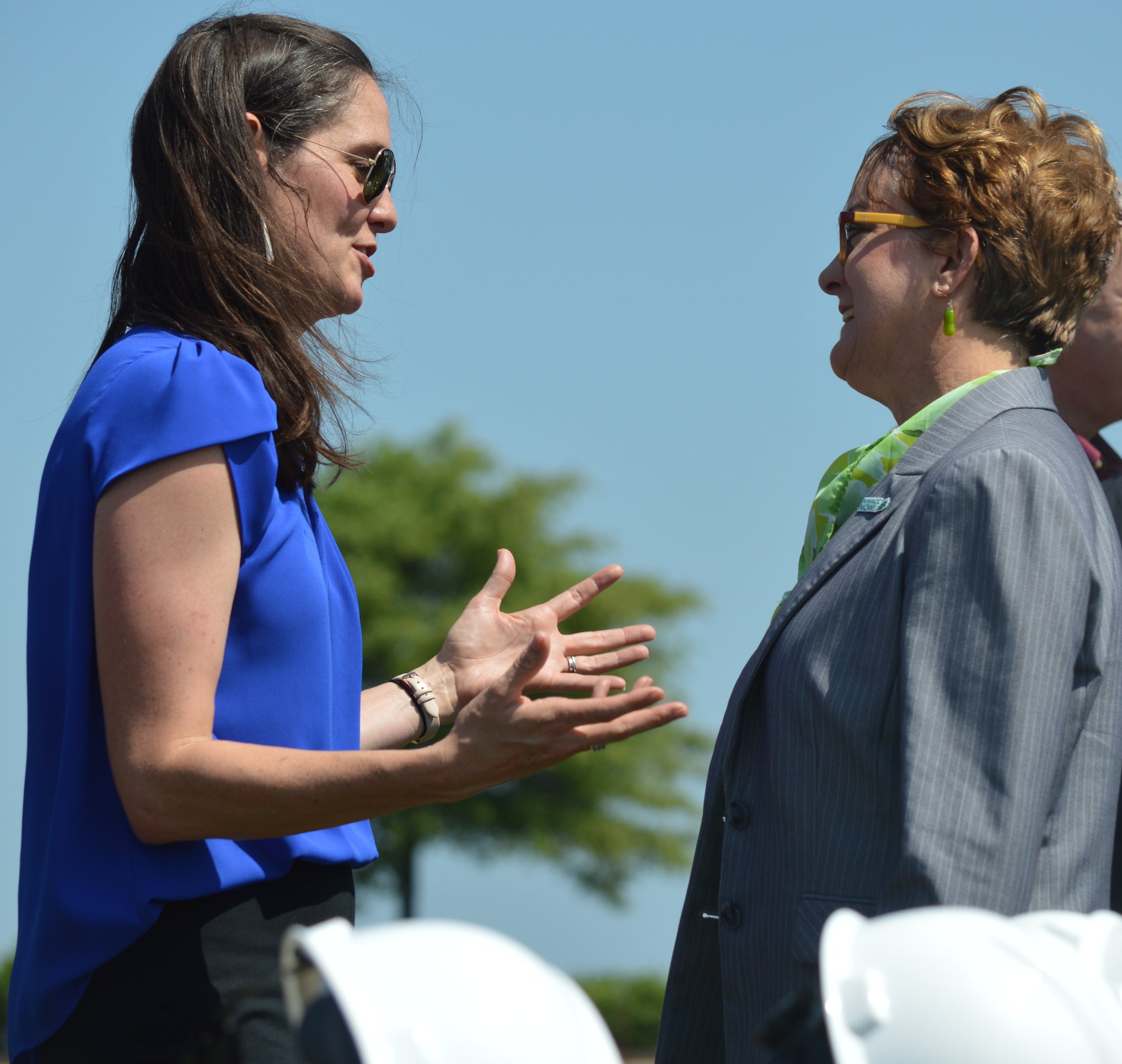 Erin Hogue of the Walmart Foundation talks with Northwest Arkansas Community College President Evelyn Jorgenson after today's groundbreaking ceremony. The Bentonville college is building an additional campus in Springdale.