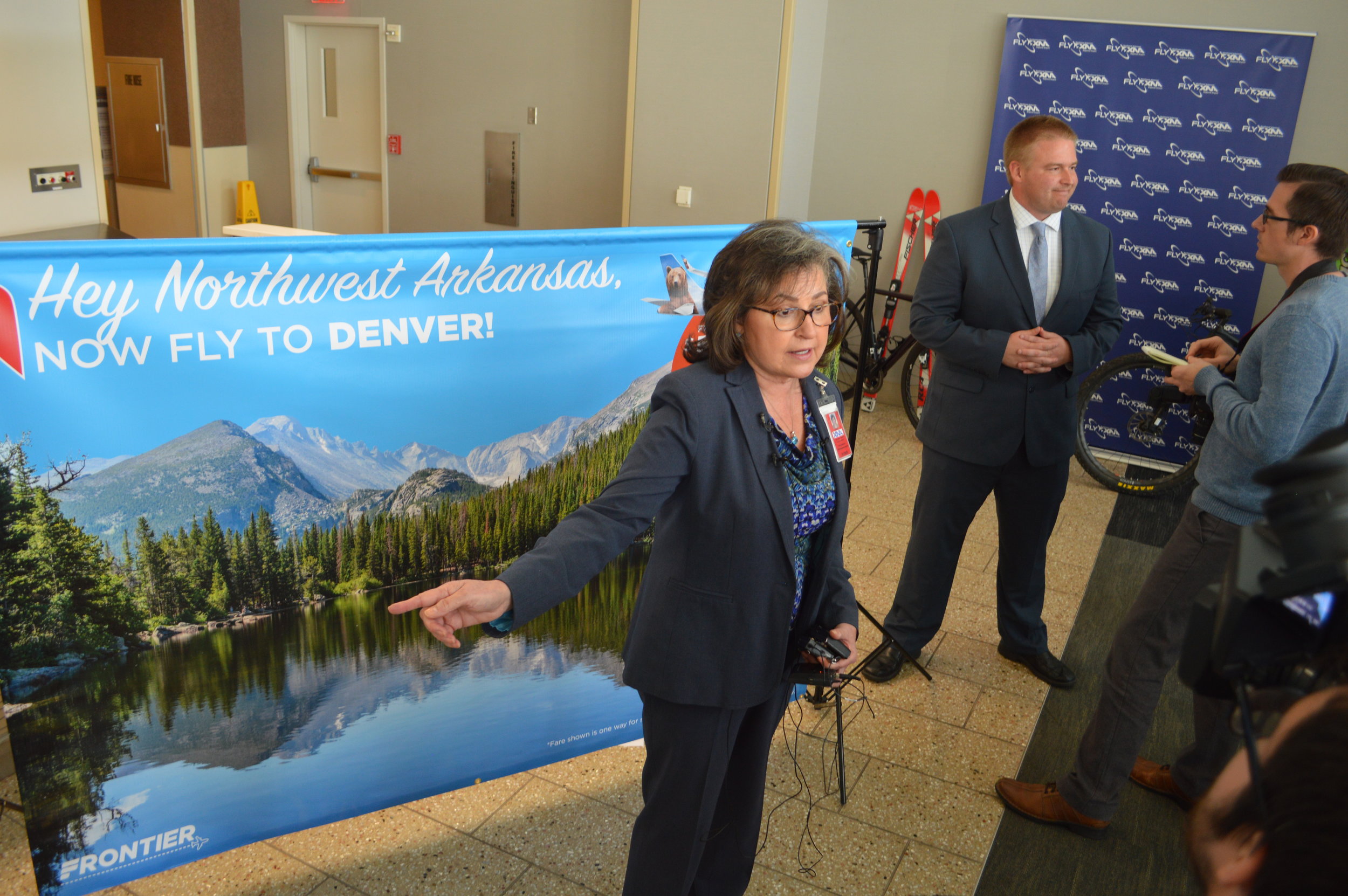 Kelly Johnson of the Northwest Arkansas Regional Airport and Jonathon Nield of Frontier Airlines answer reporters’ question about the airline’s start of flights from the airport to Denver. The first Frontier flight between the communities takes place June 27.