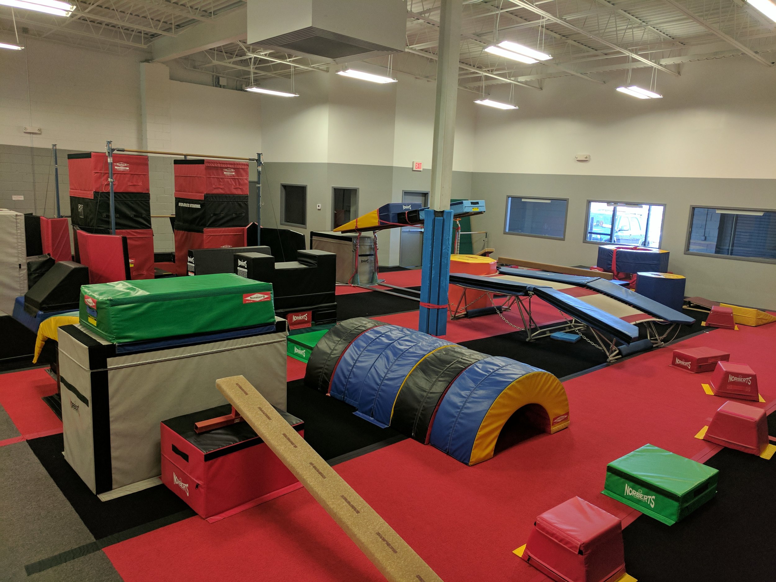 (Lower Gym partial overview) Obstacle courses including spider crawl and double-mini trampoline