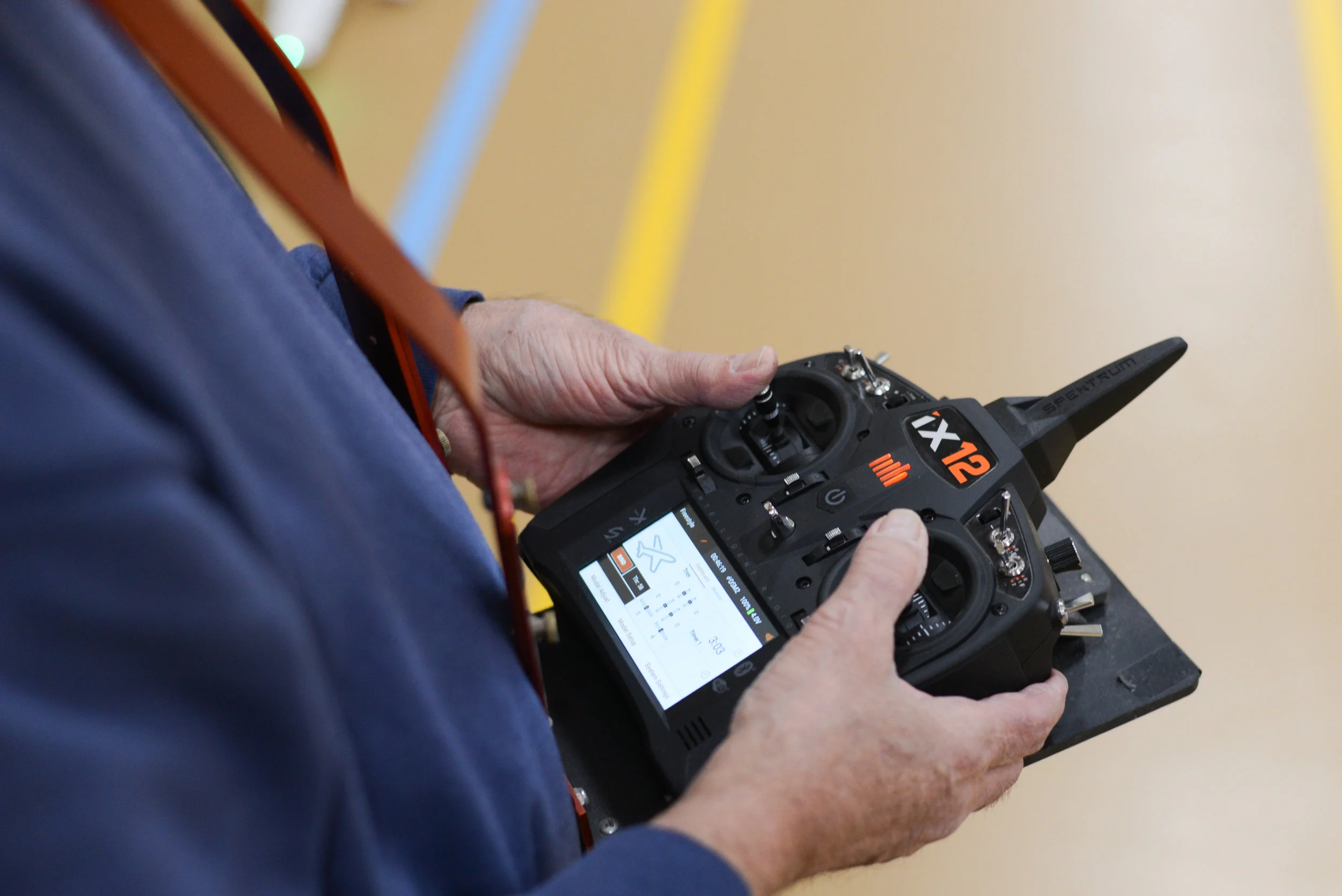  Glen Nyhus flies his RC plane using a high tech transmitter. The controller can seamlessly connect to a computer flight simulator. 