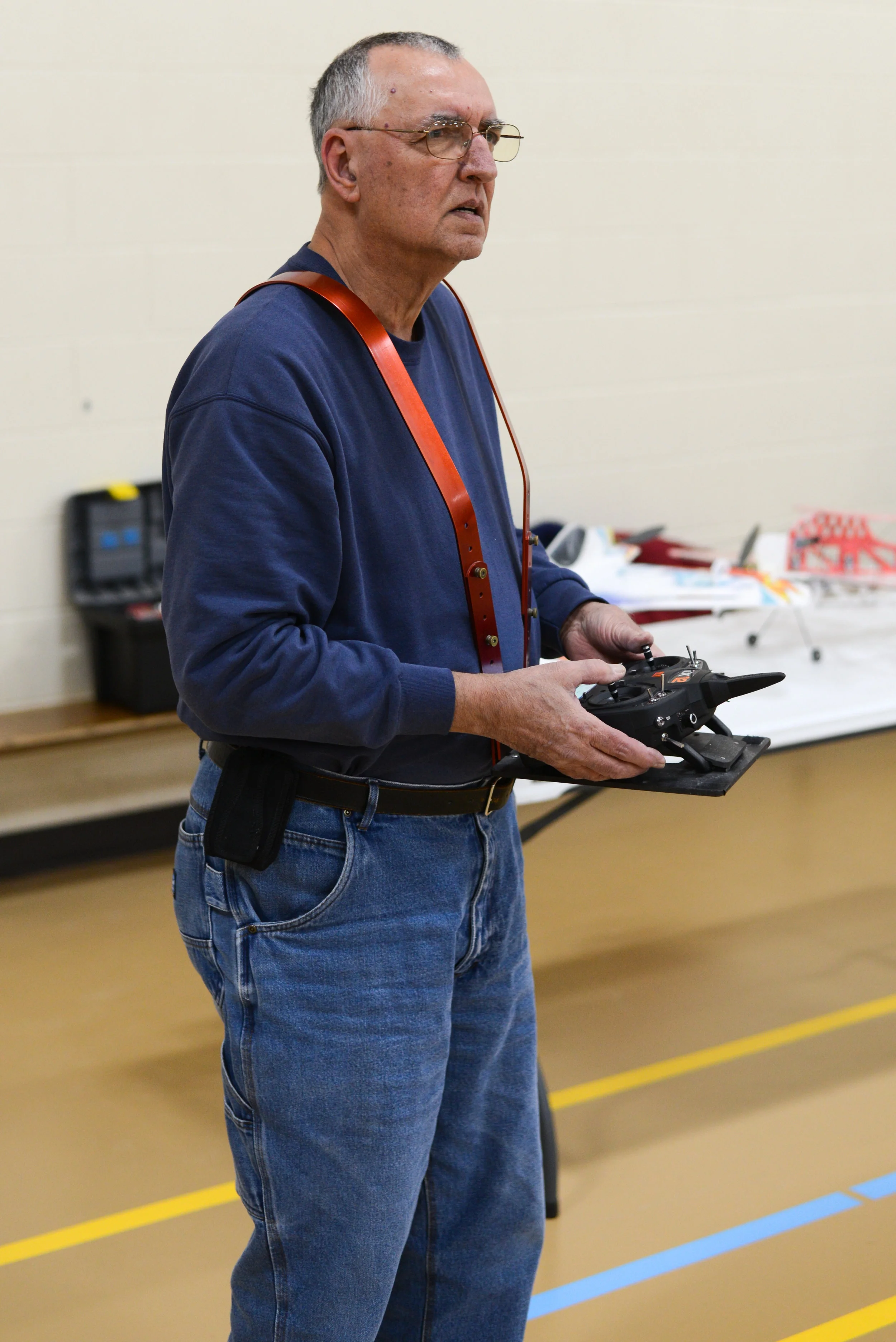  Glen Nyhus flies his RC plane around the PACC gym on Saturday, Feb. 10. "I get a lot of grief because I fly with a prosthetic, but that’s what I’m used to," Nyhus said. 