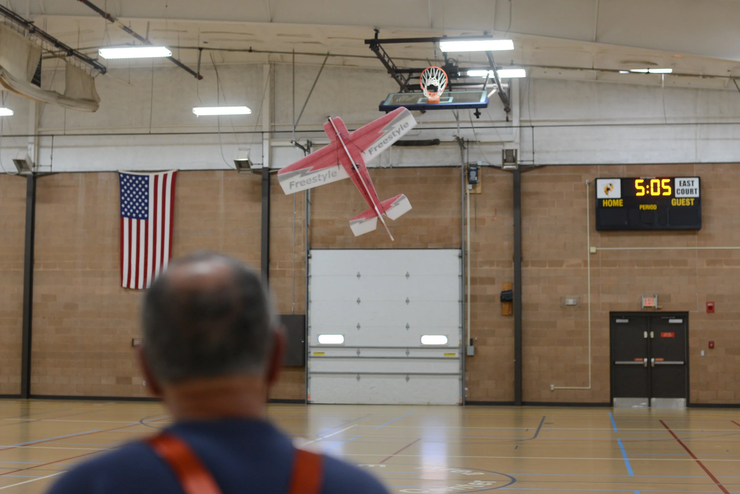  Glen Nyhus flys his ultra-light RC plane in the PACC gym on Saturday, Feb. 10. Nyhus keeps his skills sharp by flying indoors during the winter. 