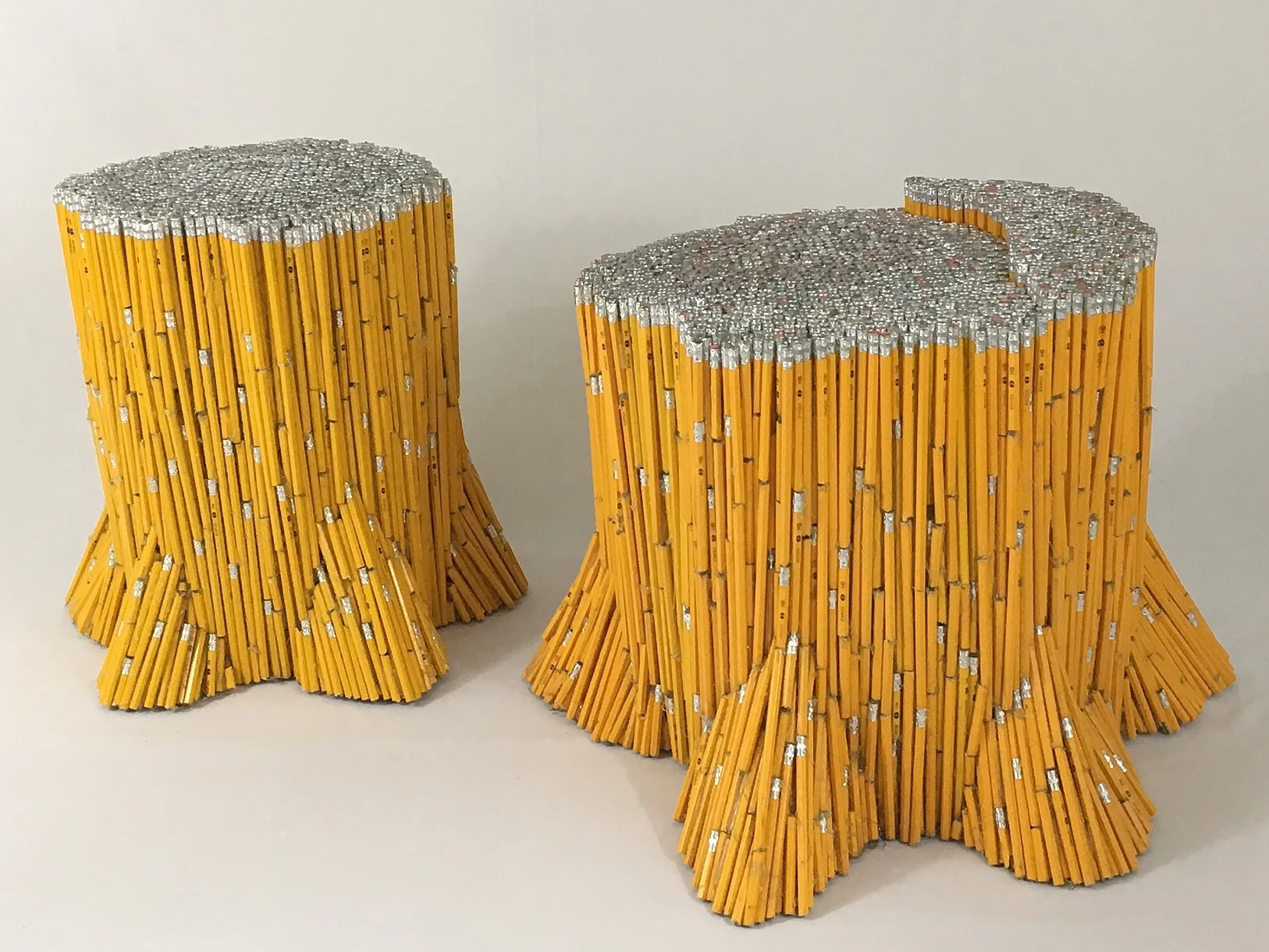 "Stumps" , 2017 Pencils, glue. Large stump: 19"x22"x24". Small stump: 19"x16"x14" Courtesy Travis Childers and Carrie Able Gallery