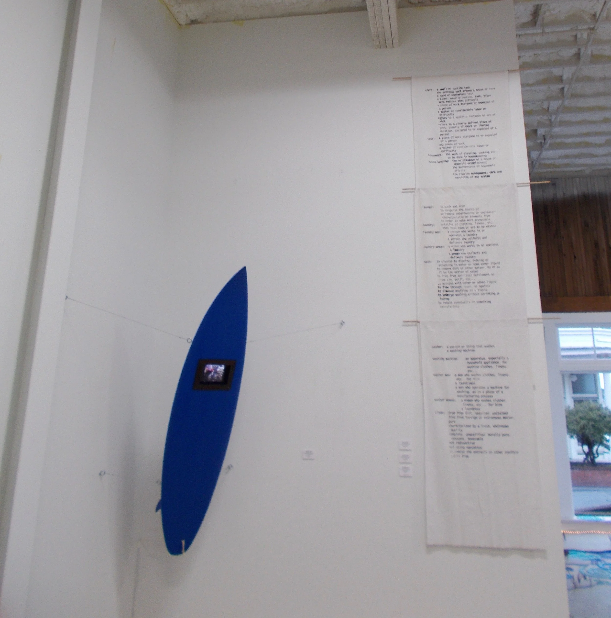 Persistence – Reclaimed surfboard, digital video, tablet, paint, leather, varnish, hardware silk screen on fabric. 2019