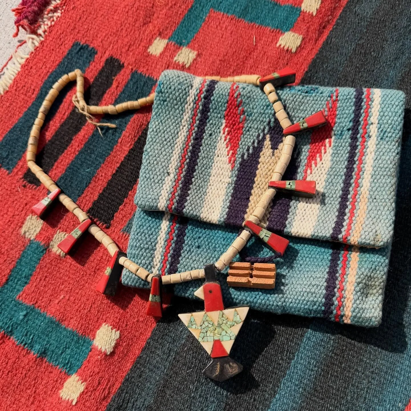 Santo Domingo Pueblo Thunderbird necklace. 

Nicknamed battery birds because during the depression the Pueblo used discarded inexpensive materials including old car battery casing in place of onyx. Some even have noticeable vinyl record pieces and pl