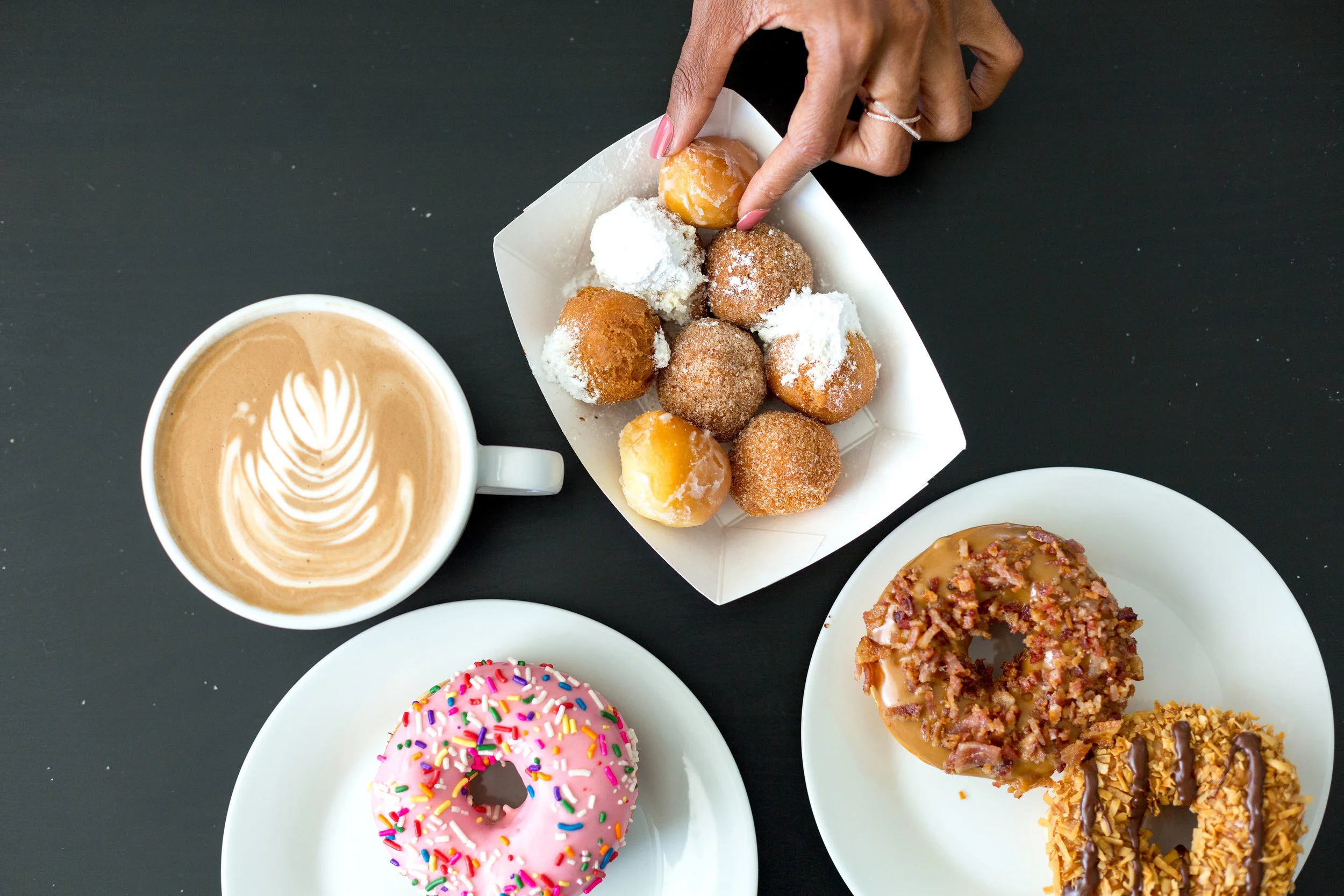 Babe's Doughnuts - pink icing, maple & bacon, samoa donuts. Donut holes are glazed, cinnamon sugar & powdered