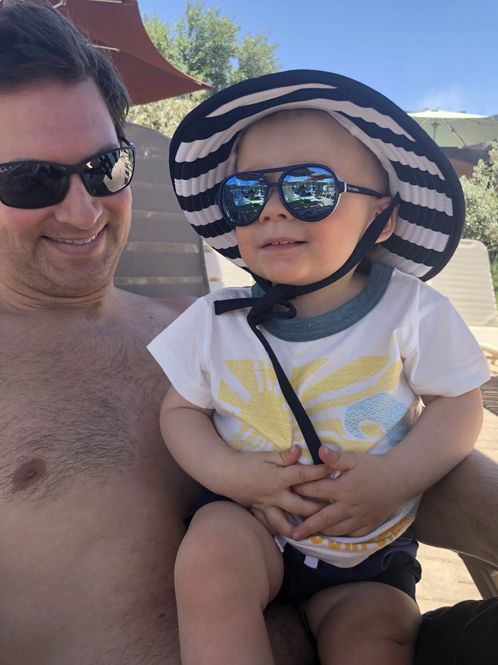 Gray’s hat, Hanna Andersson ; shirt, Mac and Mia || Jon’s sunglasses, Ray Ban