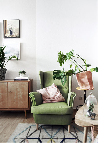Green Ikea chair and rug living room