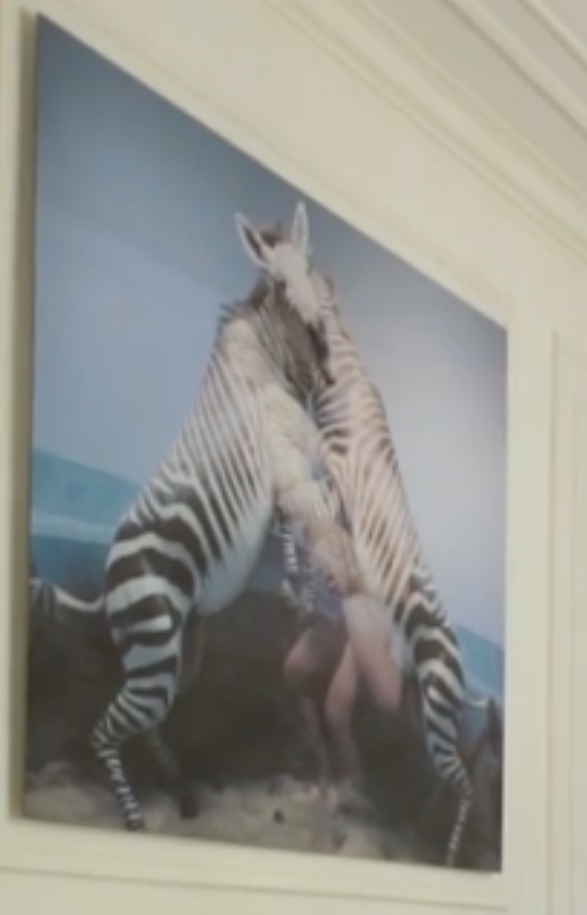 Well two, I guess, but what's with the naked human legs between them? A threesome?