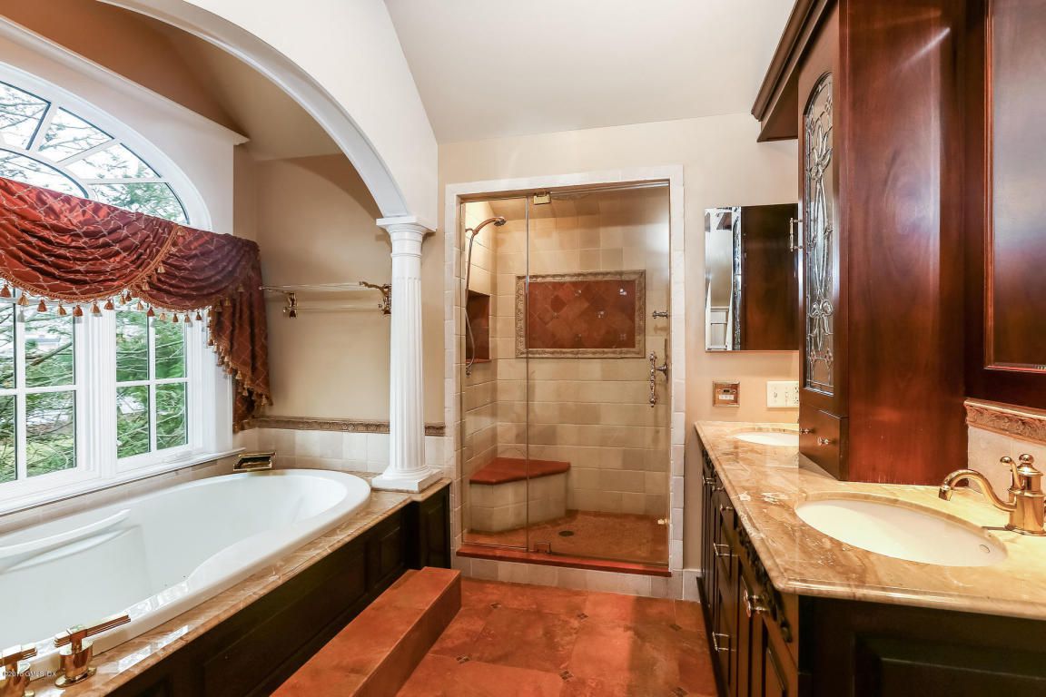 No to the pseudo-Roman bath, but the shower looks attractive