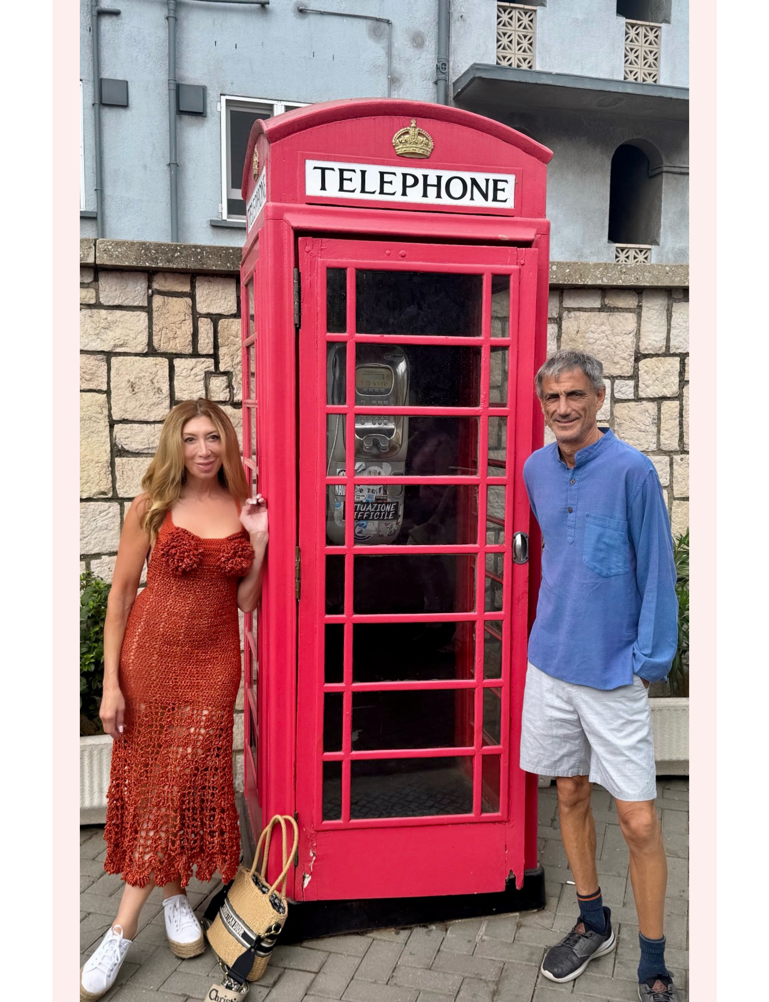 Michele Rosenthal by British phone booth in Gibraltar