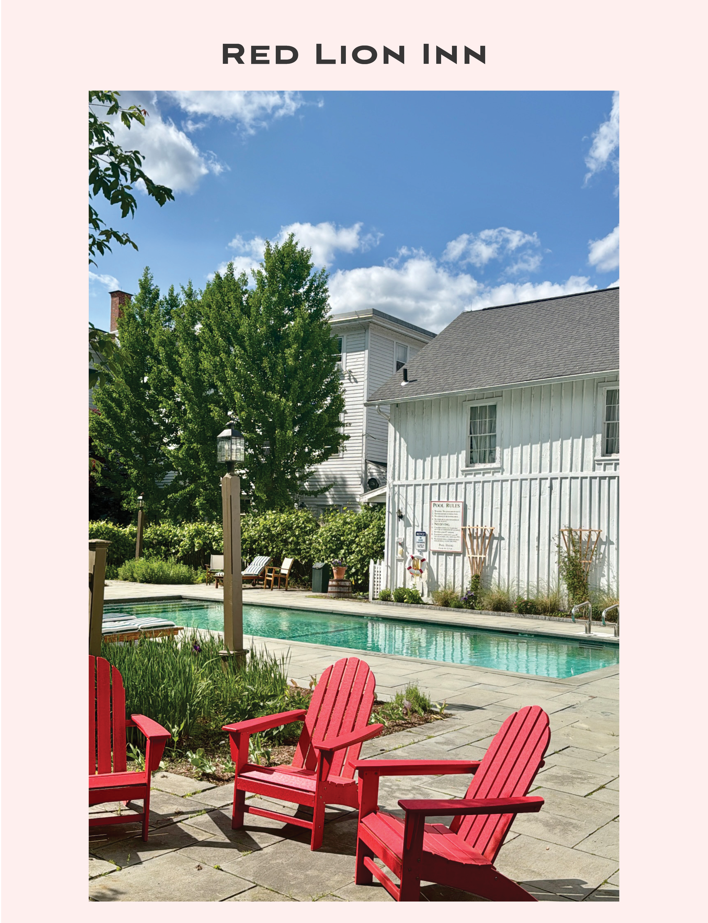 The outdoor pool area at The Red Lion Inn in Stockbridge, Massachusetts, featuring vibrant red Adirondack chairs on a stone patio alongside a classic rectangular pool