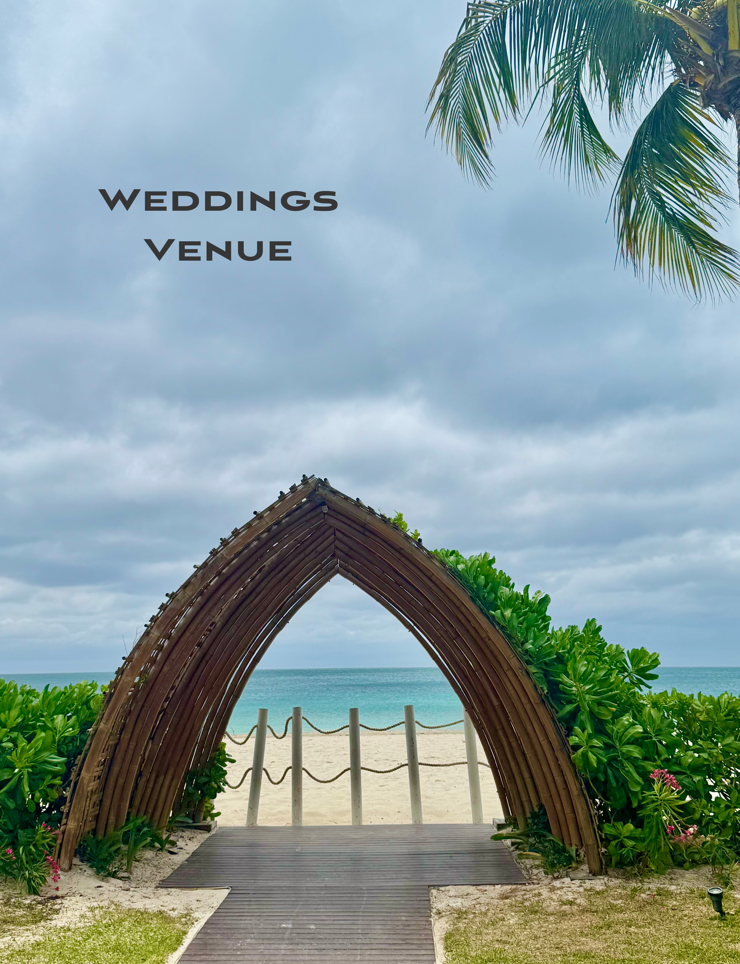 wooden wedding archway opens onto the sandy Caribbean beachfront at the adults-only all-inclusive Hyatt Zilara Riviera Maya resort in Mexico