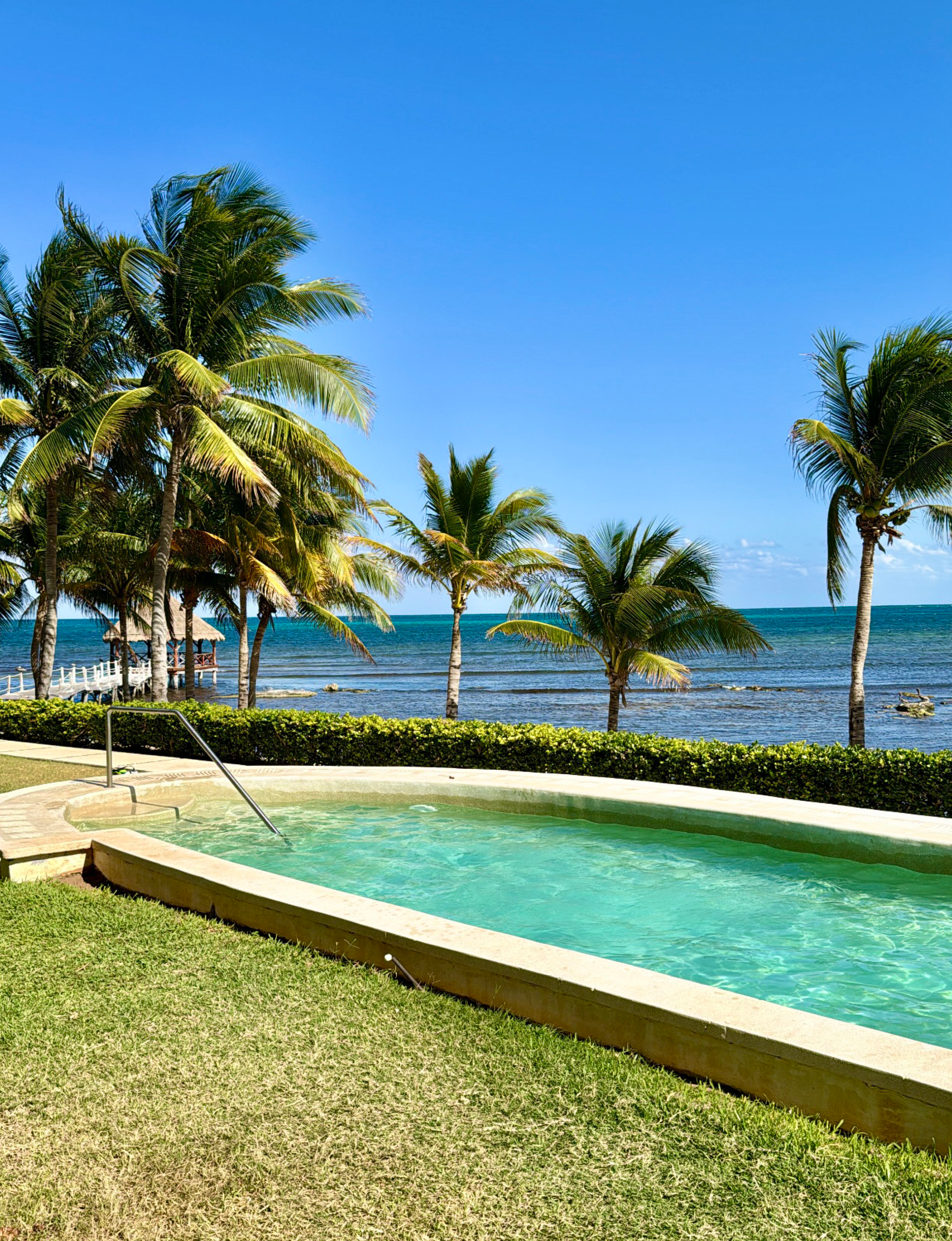 pool palms ocean at Riviera Maya in Mexico