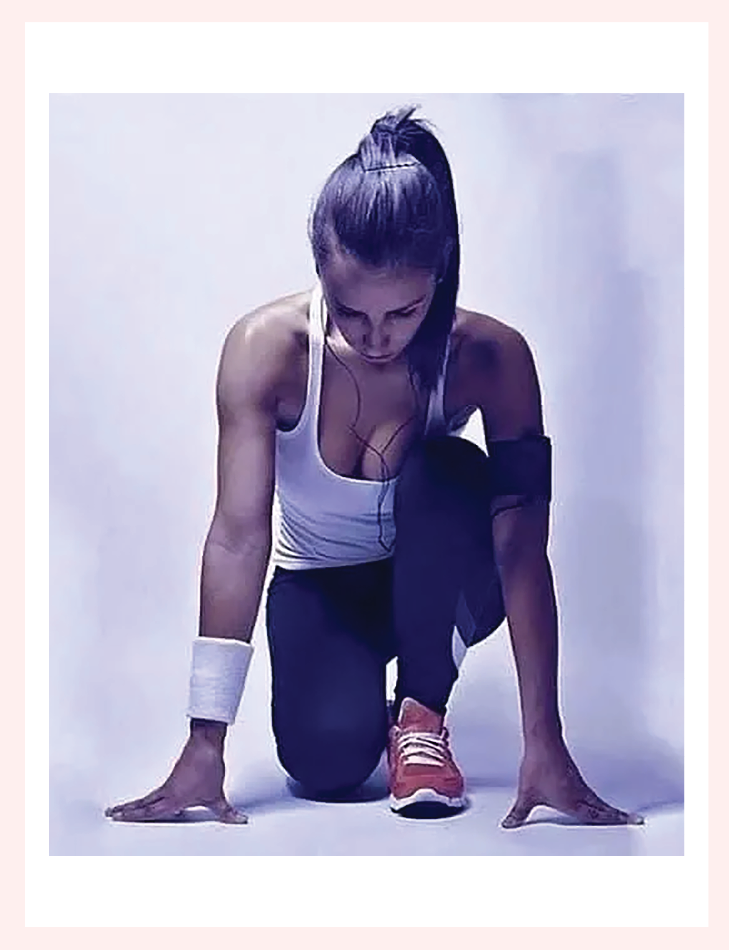 woman in workout gear and headphones