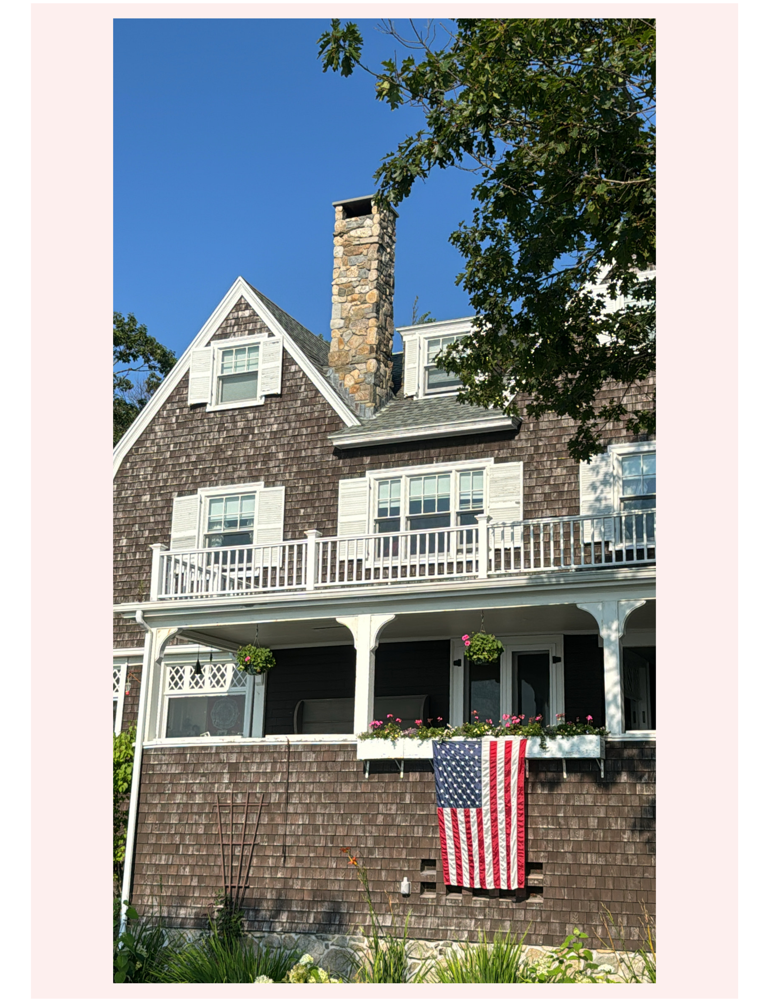 New England Maine coastal home with American flag