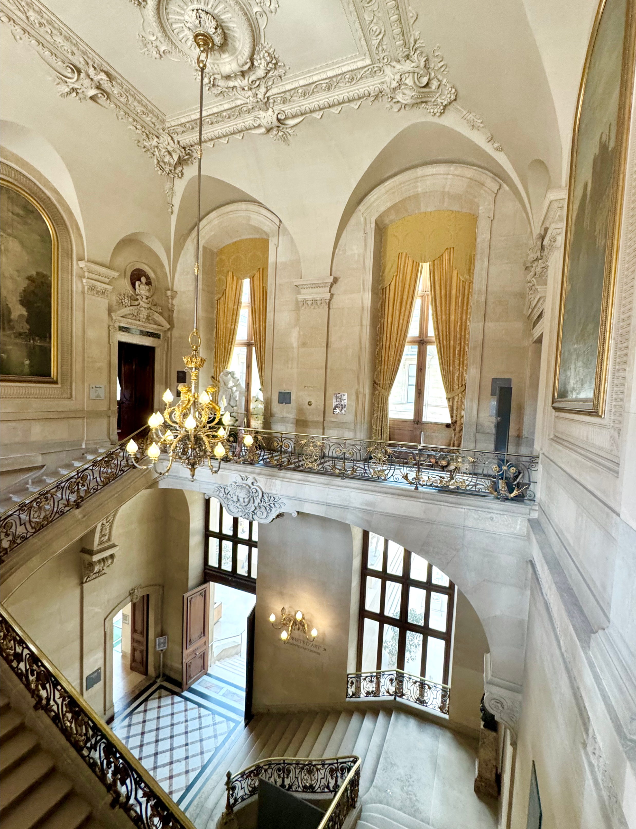 the Escalier du Ministre (Minister's Staircase) inside the Napoleon III Apartments at the Louvre Museum in Paris, France