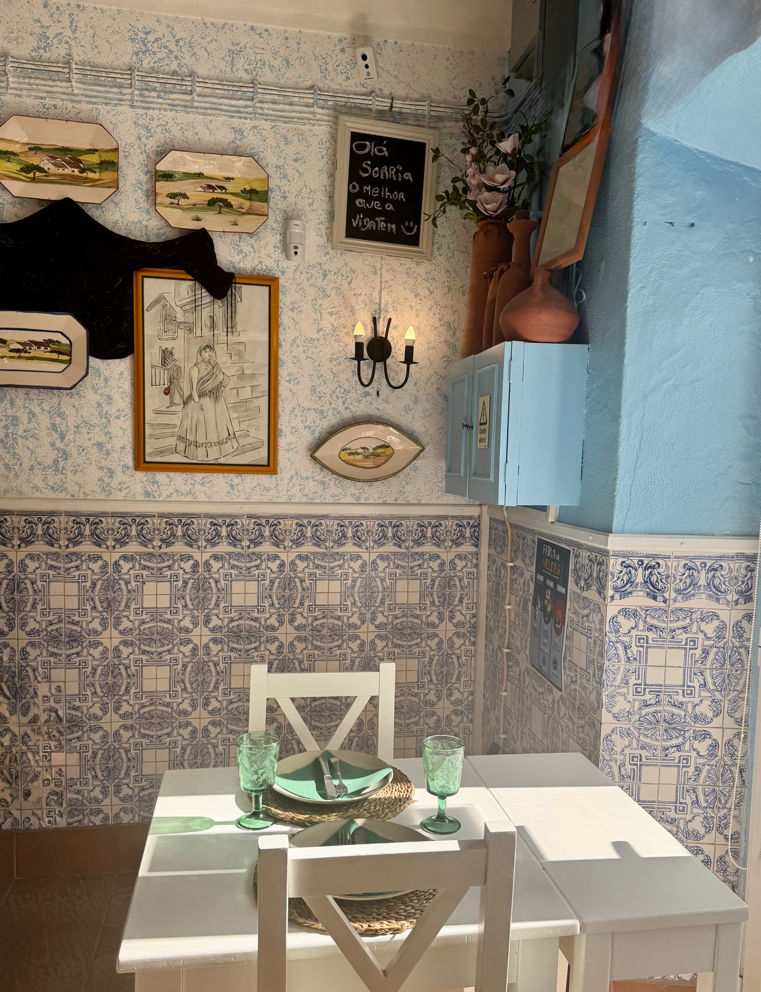 Melides Portugal restaurant interior white table with blue and white tiles