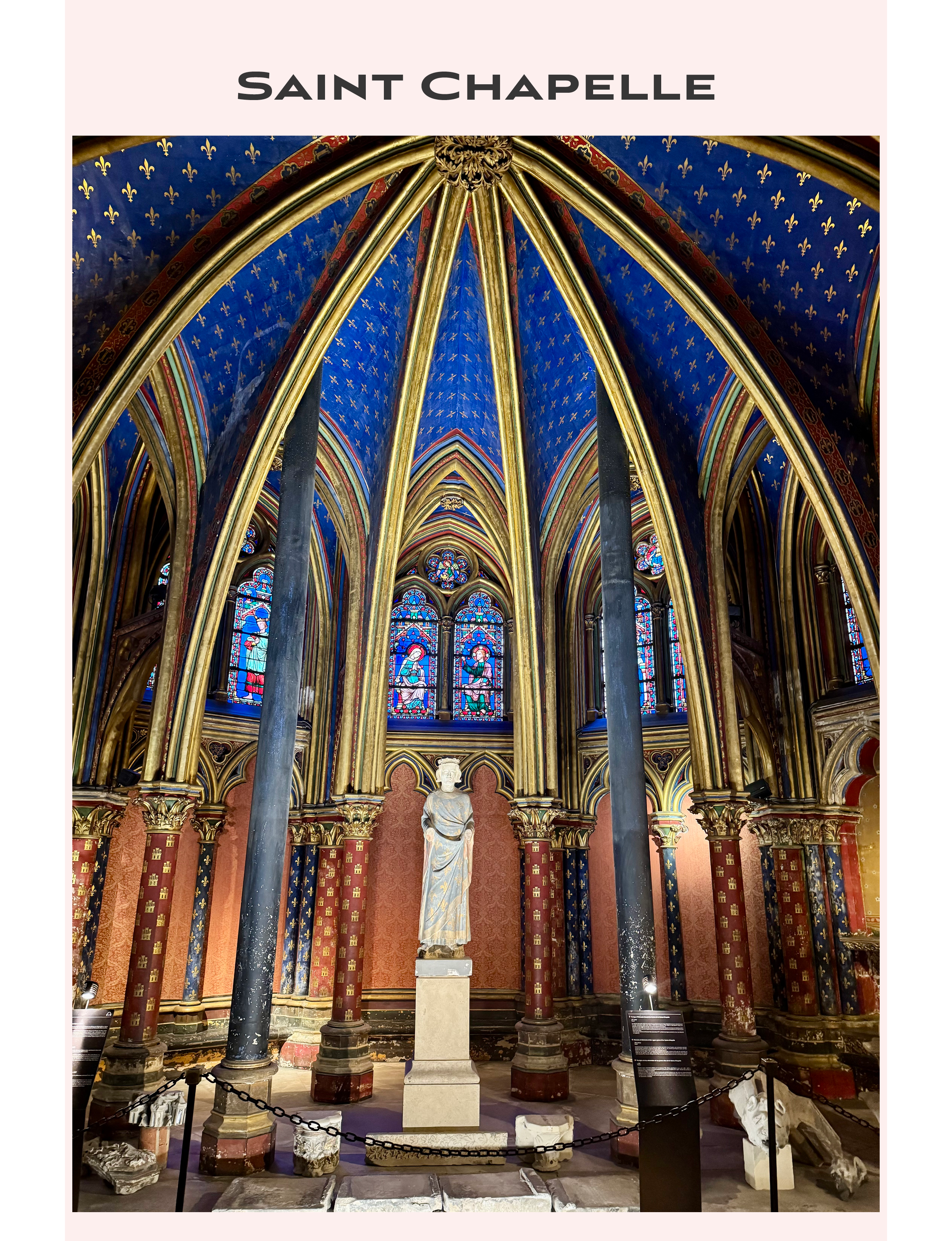 the lower chapel of Sainte-Chapelle in Paris, France featuring striking vaulted ceilings painted in deep blue with gold fleur-de-lis