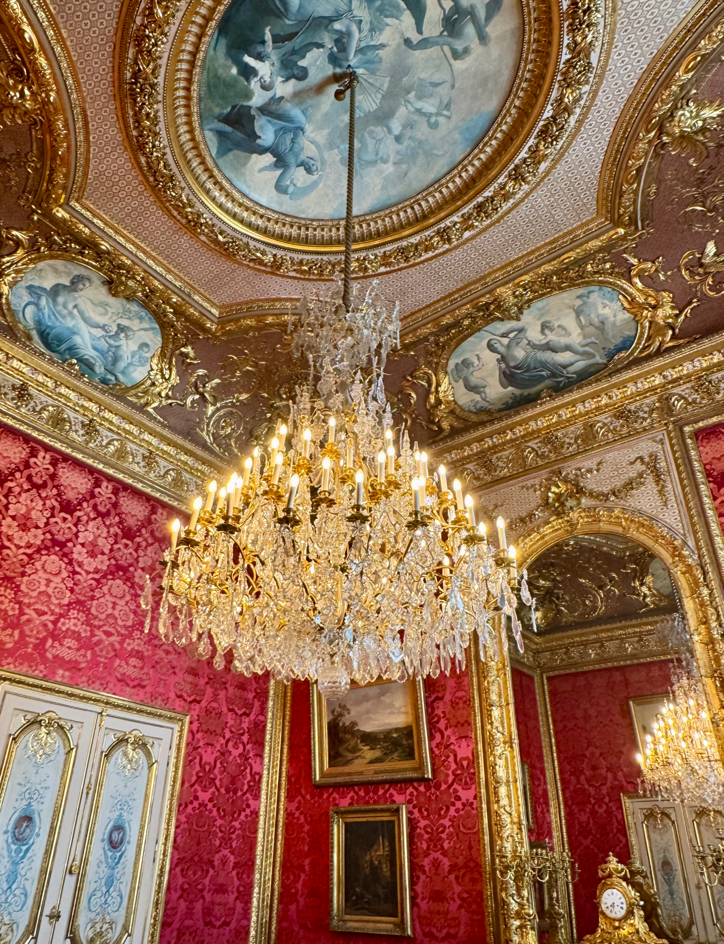 opulent interior view shows the Appartements Napoléon III, located in the Richelieu Wing of the Louvre Museum in Paris, France. These preserved state rooms reflect the lavish interior design of the Second French Empire in the 1860s