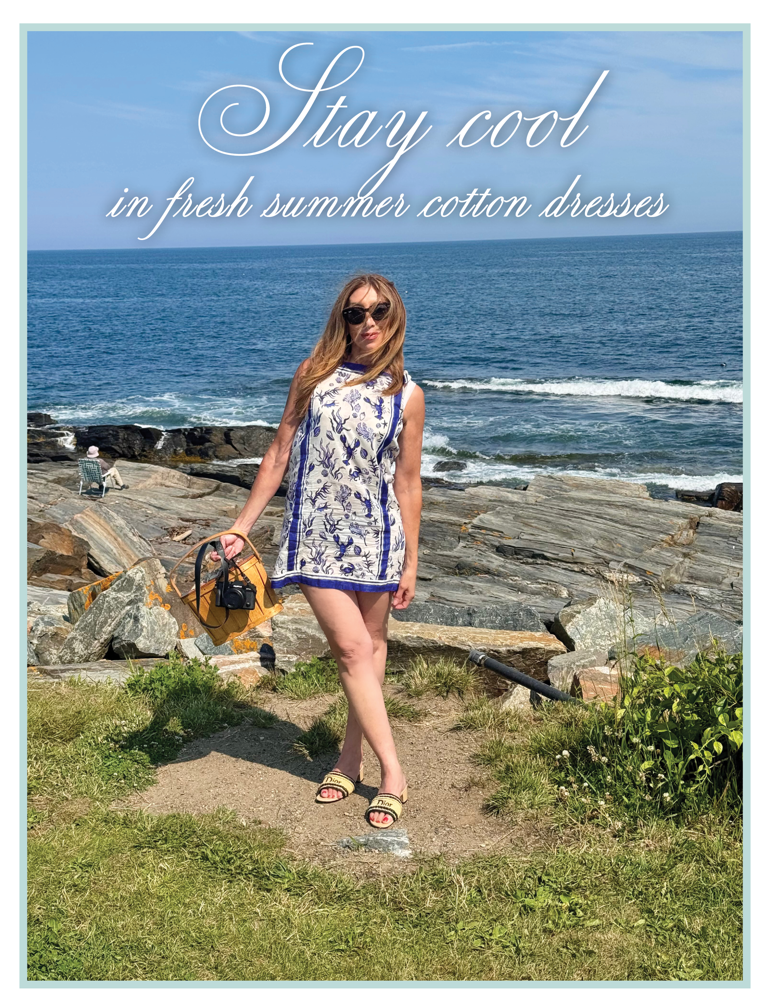 Michele Rosenthal in a blue-and-white patterned J.Crew Sadie beach dress in cotton voile seashell print by the rocky coastline of Maine