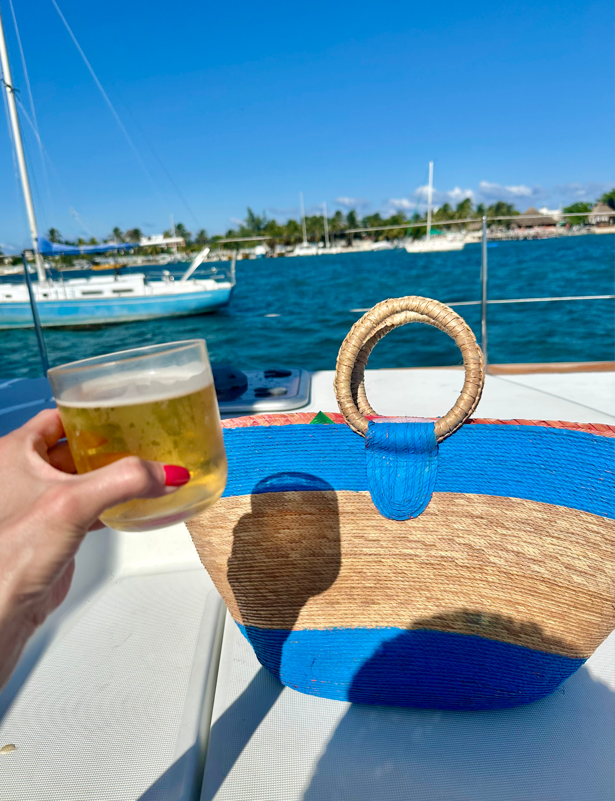 having a beer aboard a catamaran in Isla Mujeres Mexico