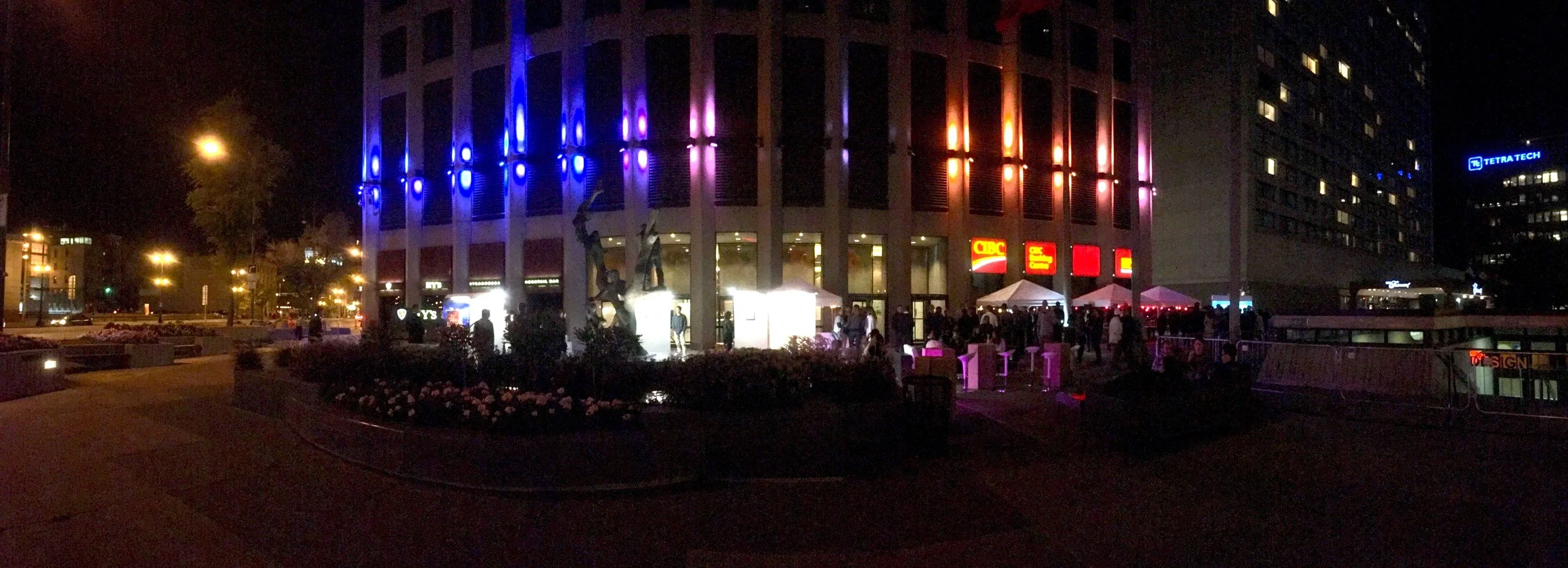 Winnipeg Design Festival Finale Party, 2016 - "ADAPTATION": Installation curated by Zephyra Vun. Immediately following a panel discussion about the re-imagination of Portage and Main AT Portage and Main (site: Richardson Building Plaza), four local artists paint live, displaying their individual reinterpretations of the iconic intersection on large, lit-up panels. The public also had an opportunity to contribute to the conversation (see below).